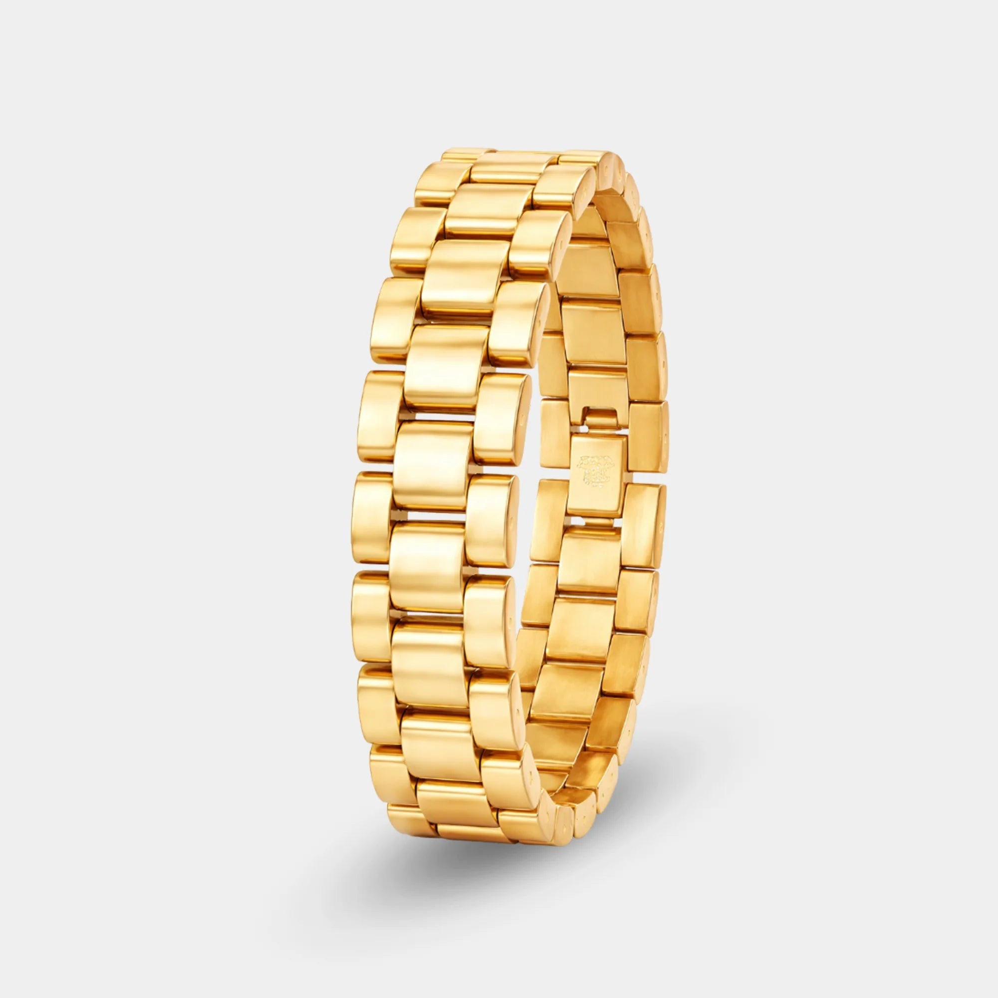 Gold watch-style chain bracelet shown on a woman's wrist