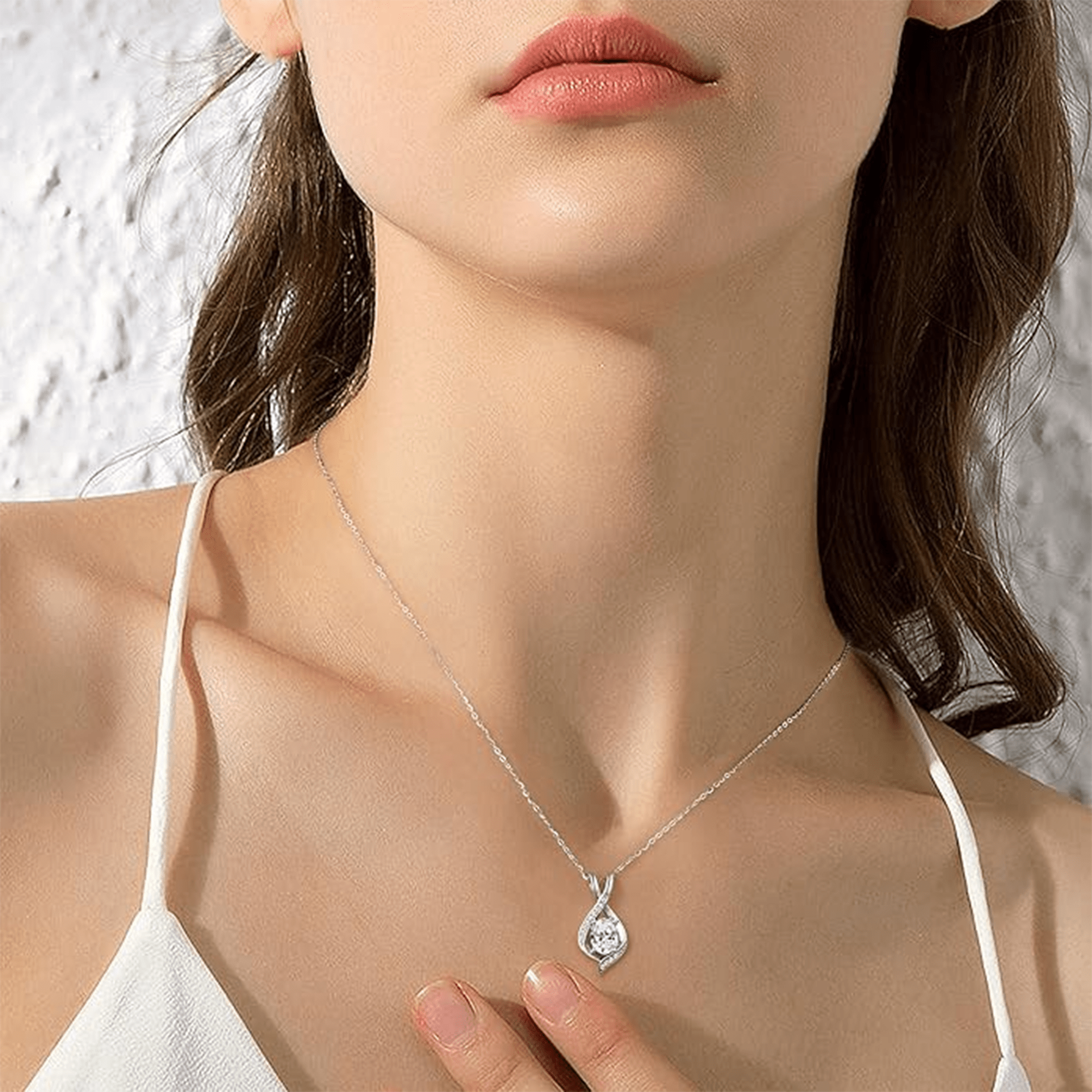 White gold plated oval CZ sparkle pendant, close detail of the setting