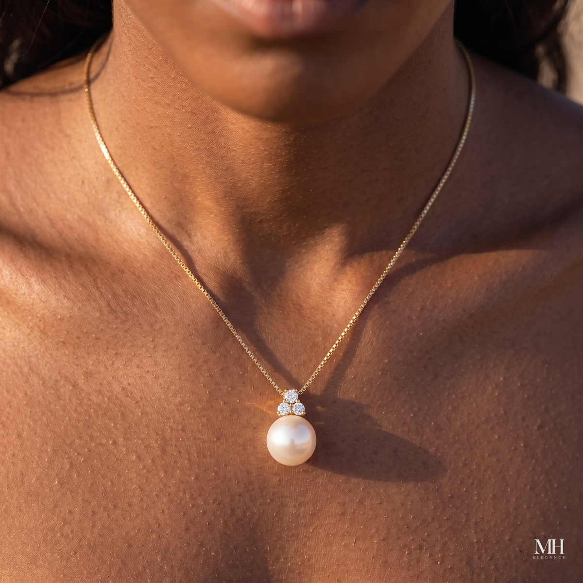 Woman wearing white freshwater pearl pendant with cubic zirconia accent on 18-inch gold chain