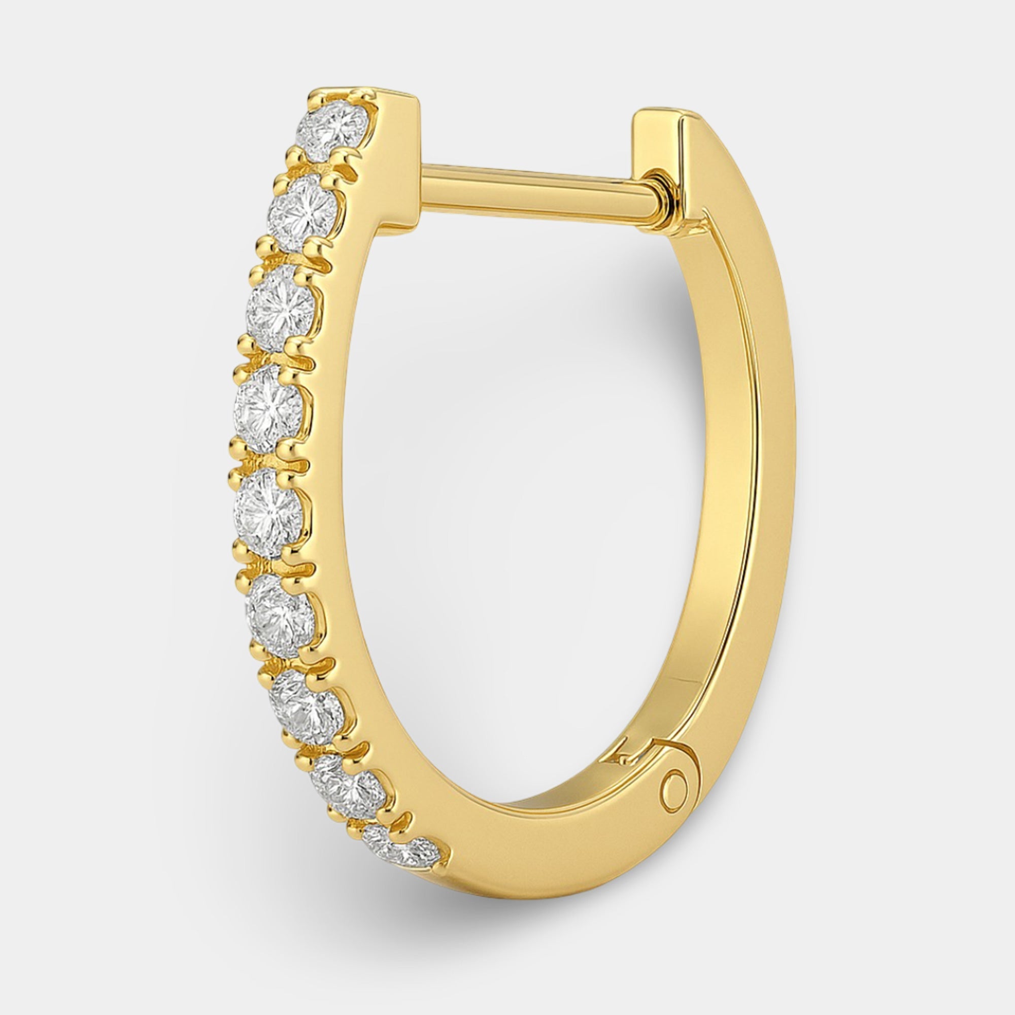 CZ huggie hoop earrings worn on the ear for a close-fitting everyday look