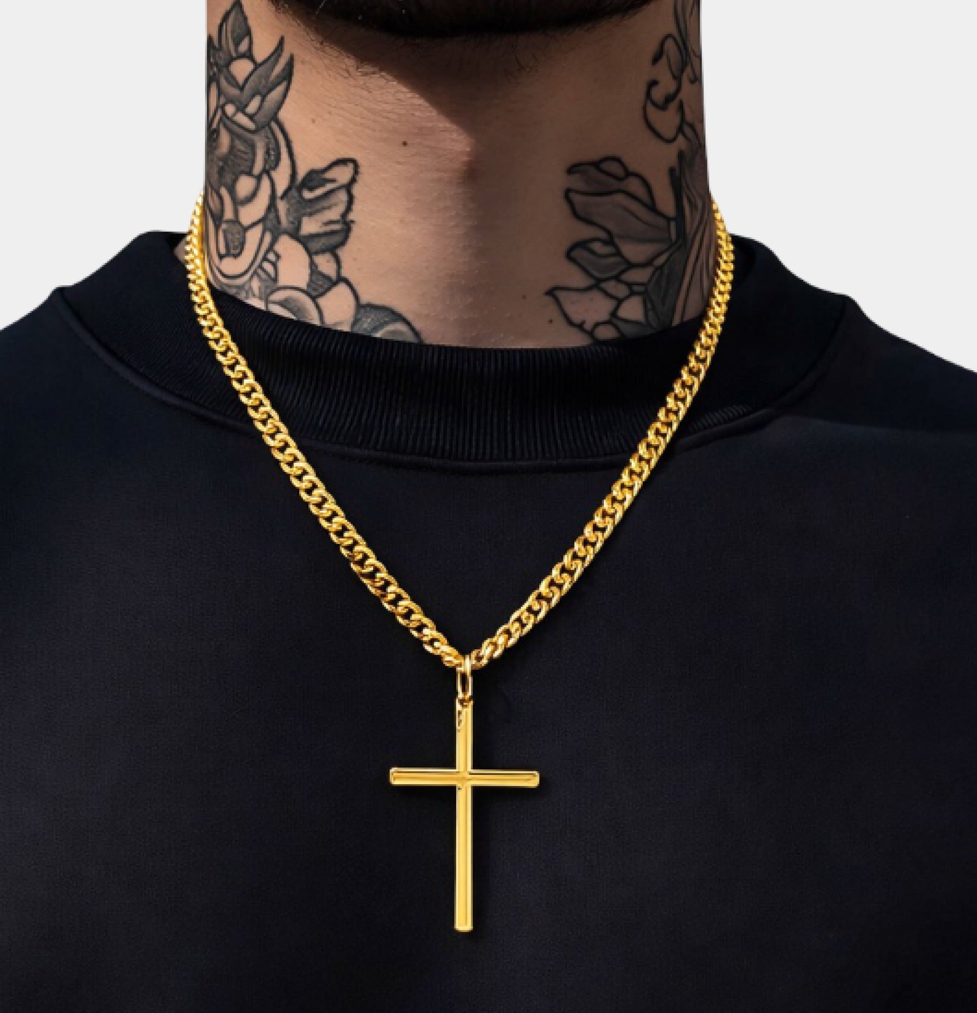Close-up of the gold Cuban link chain on the MH Elegance cross necklace