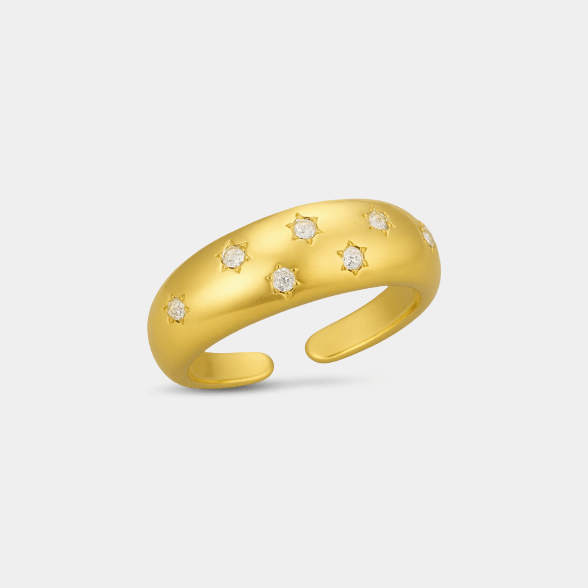 Close-up of geometric star motif with sparkling zircon inlay on an 18K gold plated 925 sterling silver celestial ring