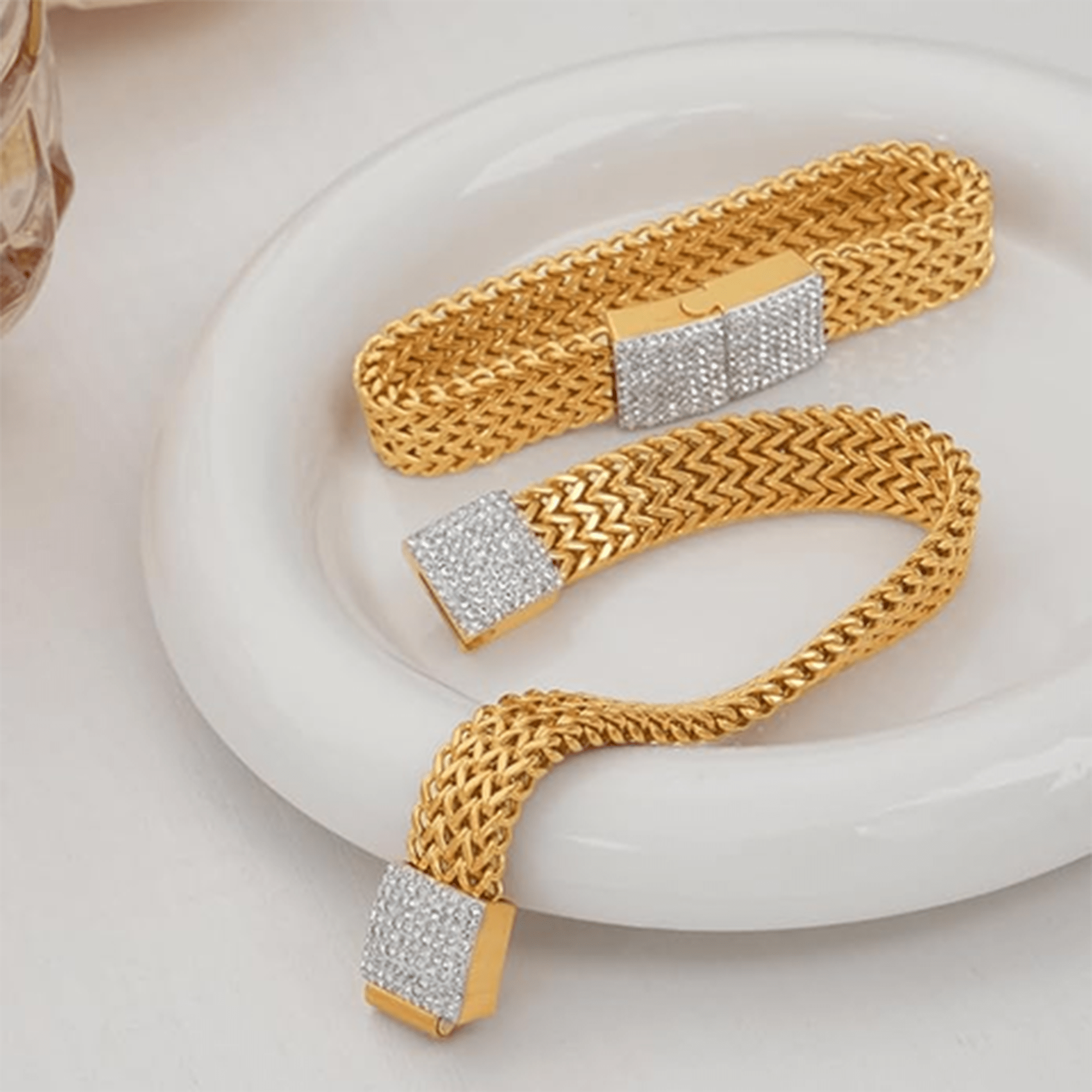 Gold mesh bracelet shown in the MH Elegance gift box