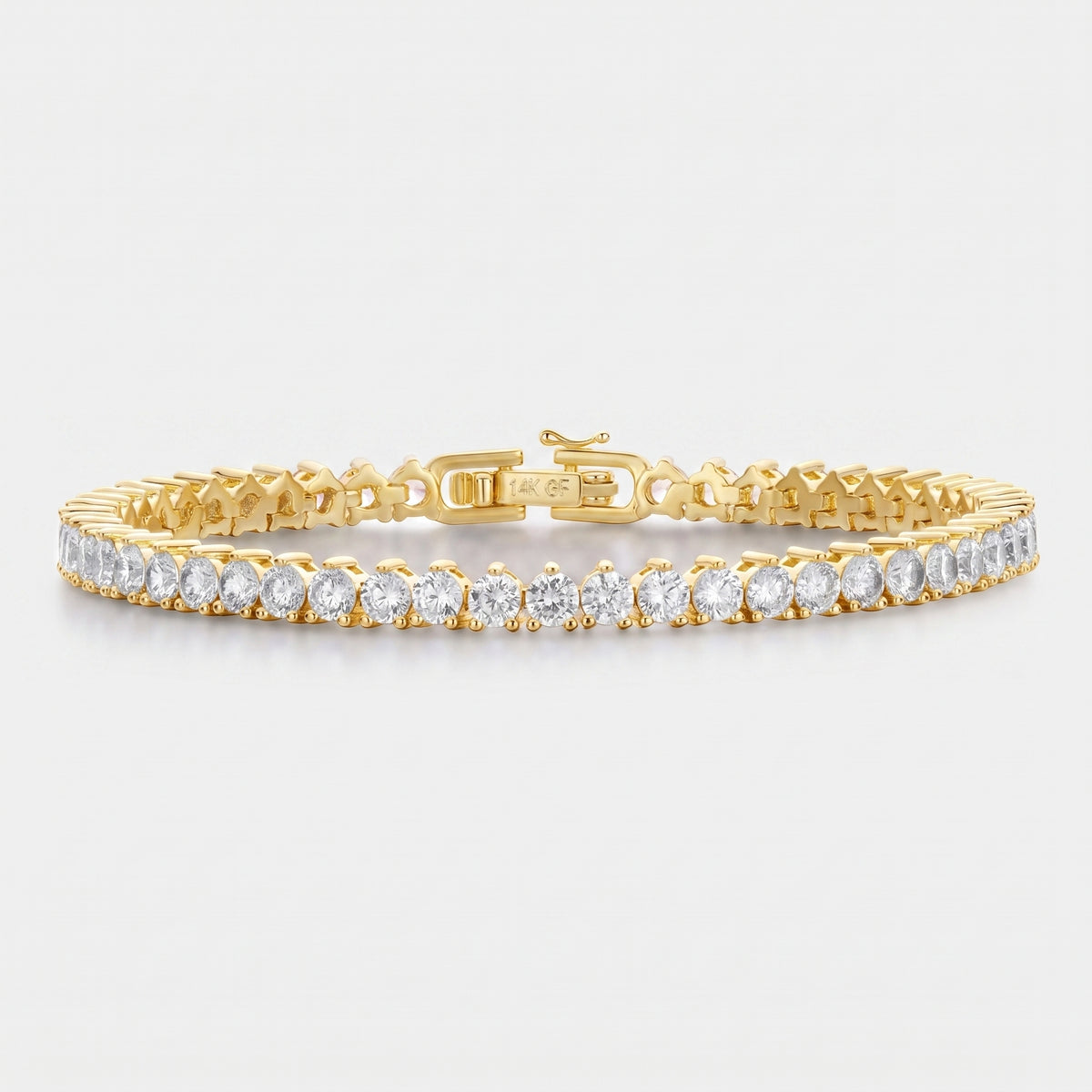A yellow gold tennis bracelet featuring a row of round-cut clear gemstones, displayed on a clean light gray background.