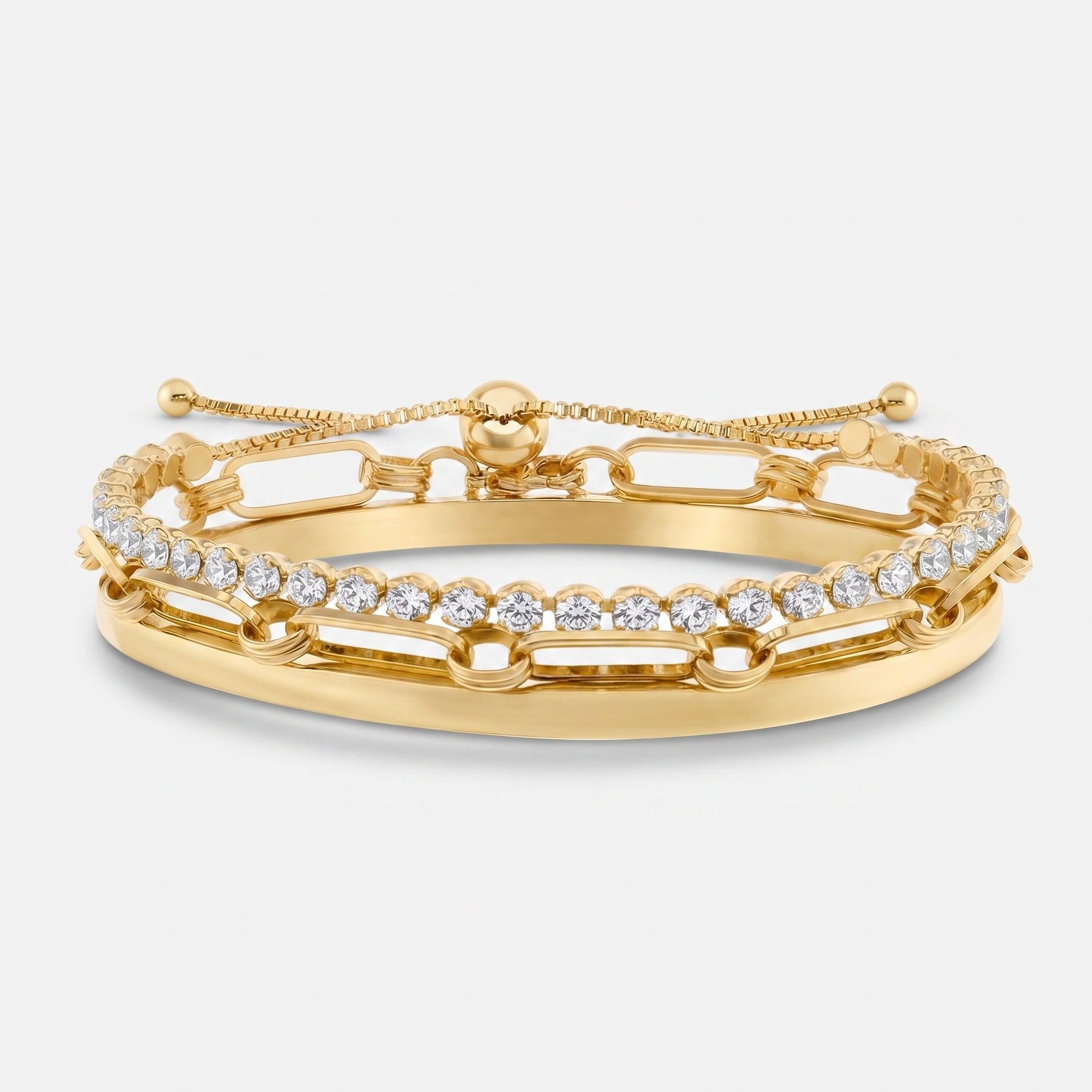 A gold adjustable bracelet with a double-row design, featuring one row of round clear stones and a chain link pattern on the other, set against a light gray background.