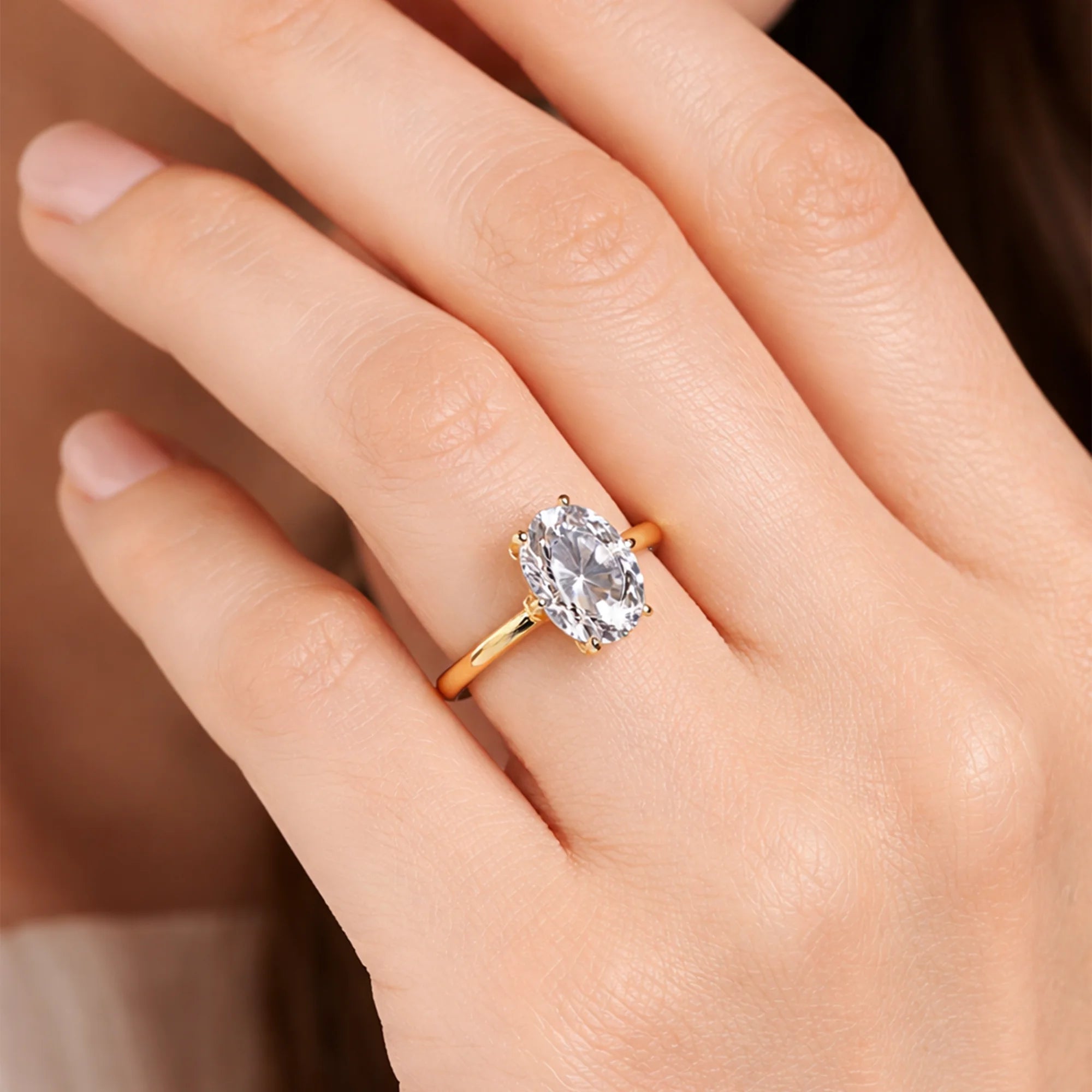 Top view of the 3CT oval cut cubic zirconia solitaire ring showing the bright white stone and gold finish