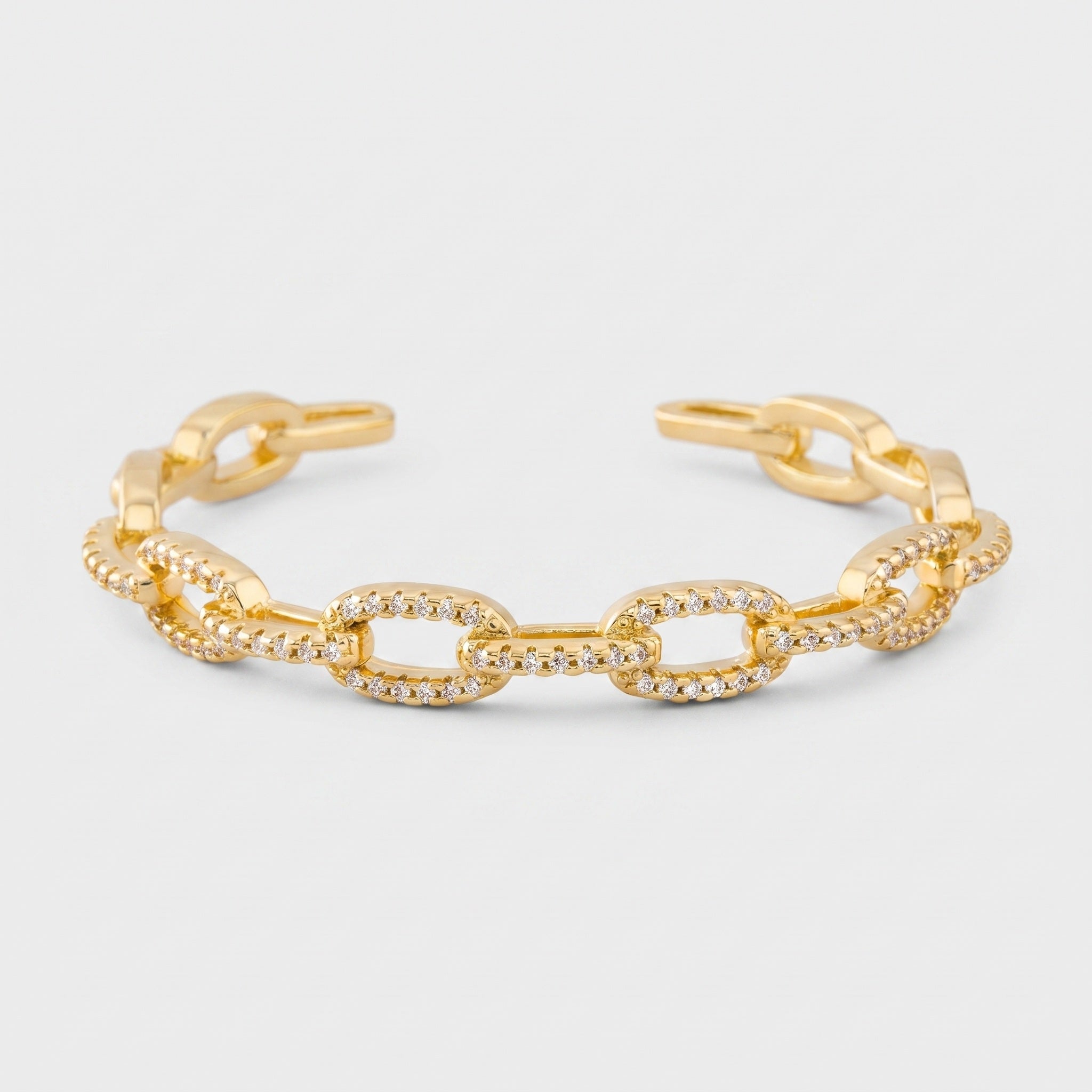 Gold chain link cuff bracelet in 14K gold plated brass with cubic zirconia pave links