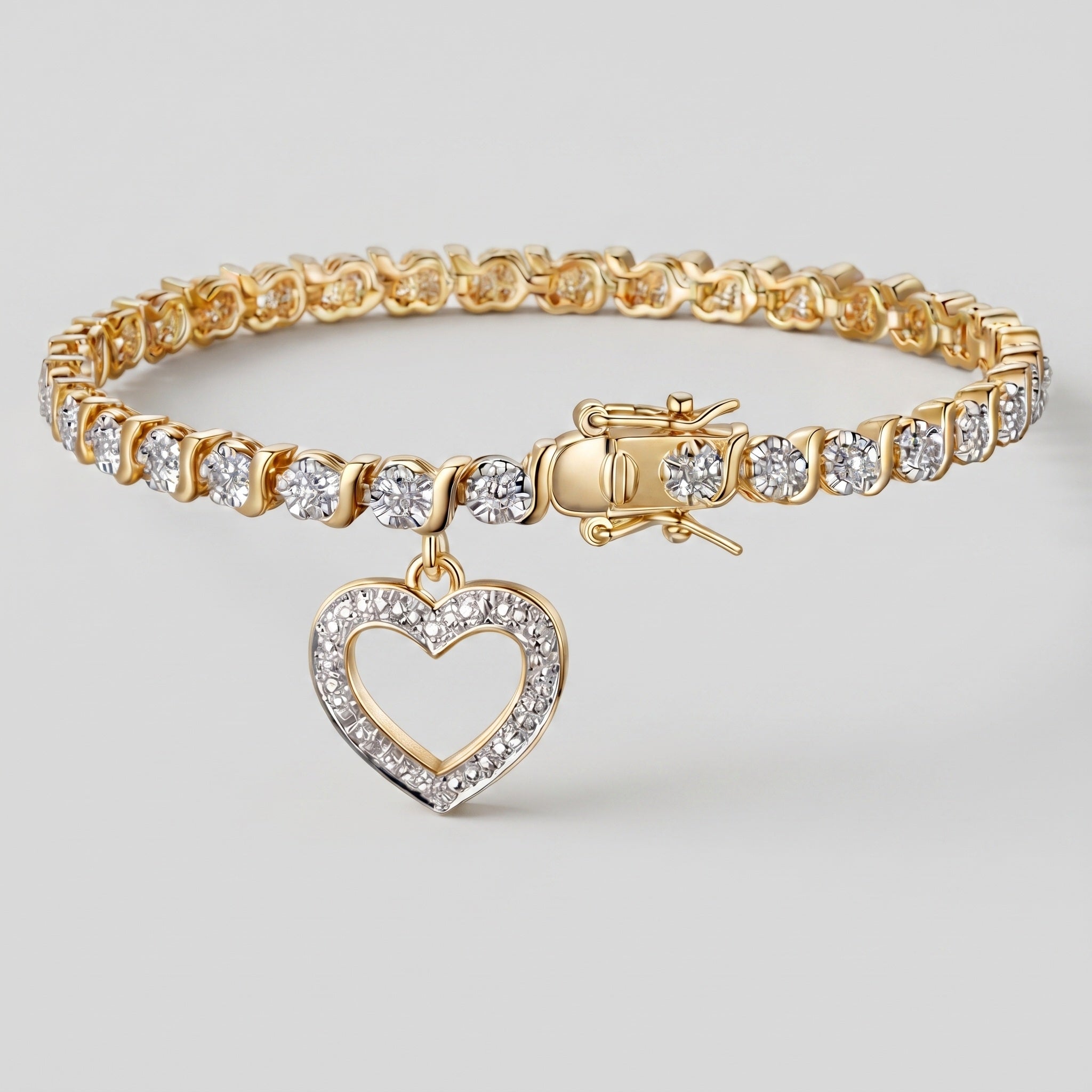 Diamond accent heart charm tennis bracelet in 14K gold plated bronze