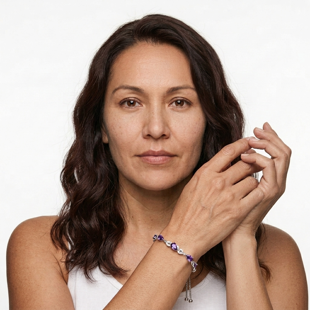 Woman wearing sterling silver amethyst bracelet with hands clasped together