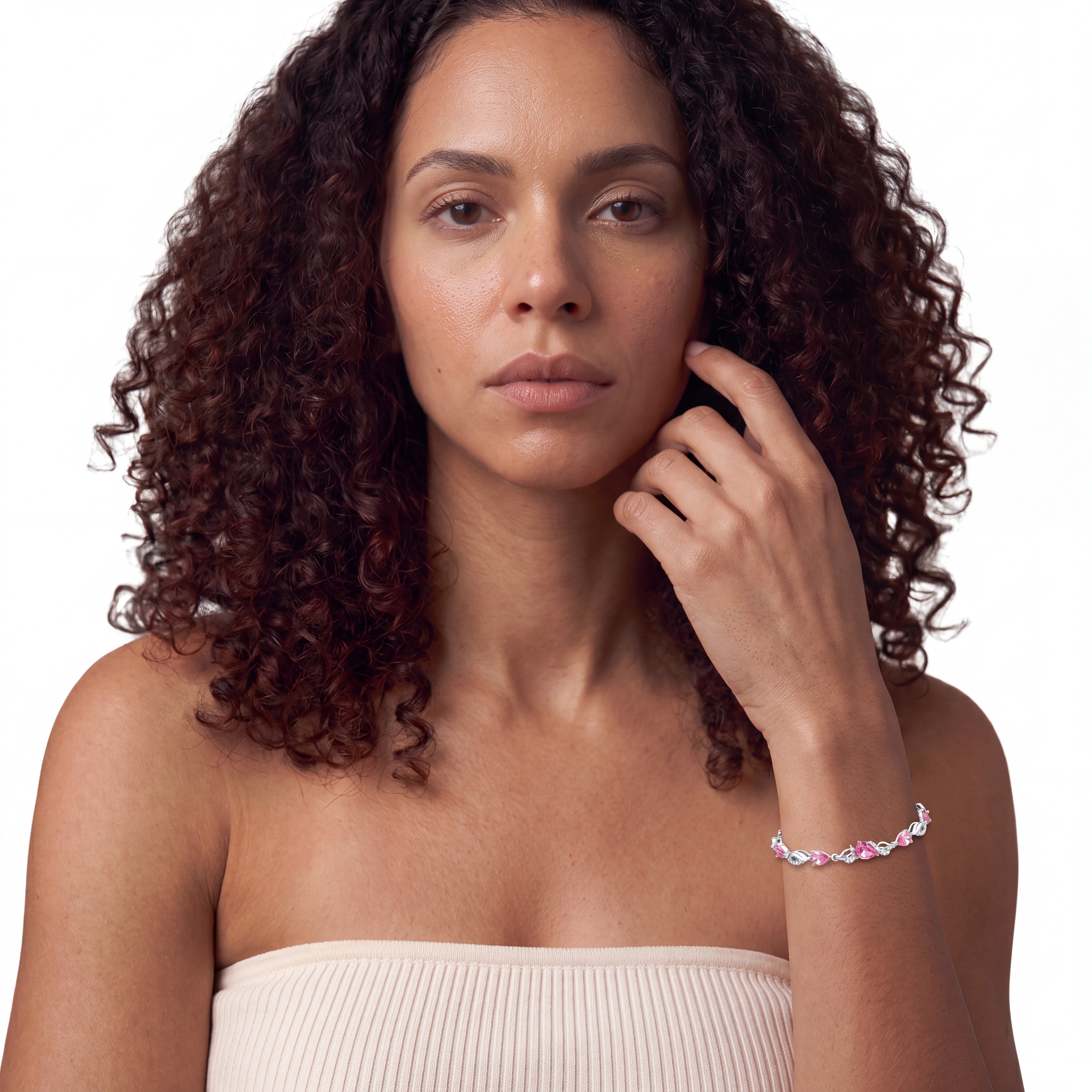 Pink tourmaline tennis bracelet worn on the wrist, close styling shot