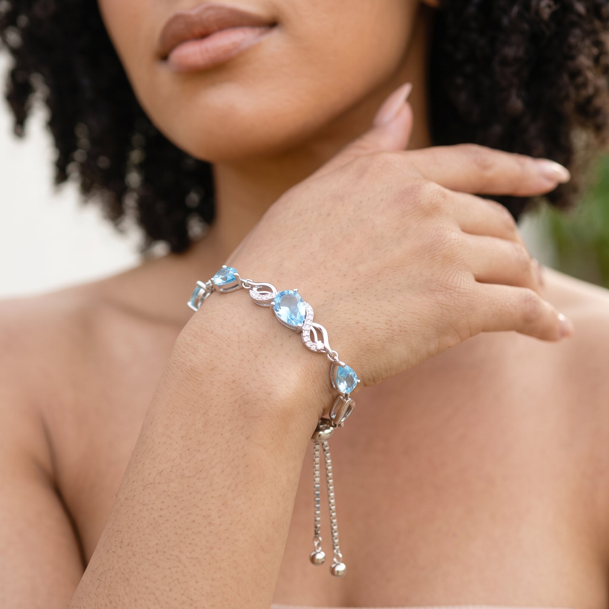 Close-up of aquamarine teardrop bracelet worn on the wrist