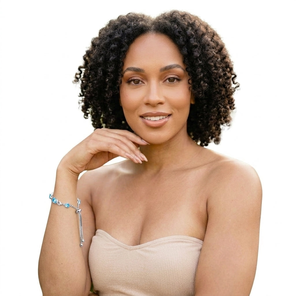 Woman smiling while wearing sterling silver aquamarine bracelet