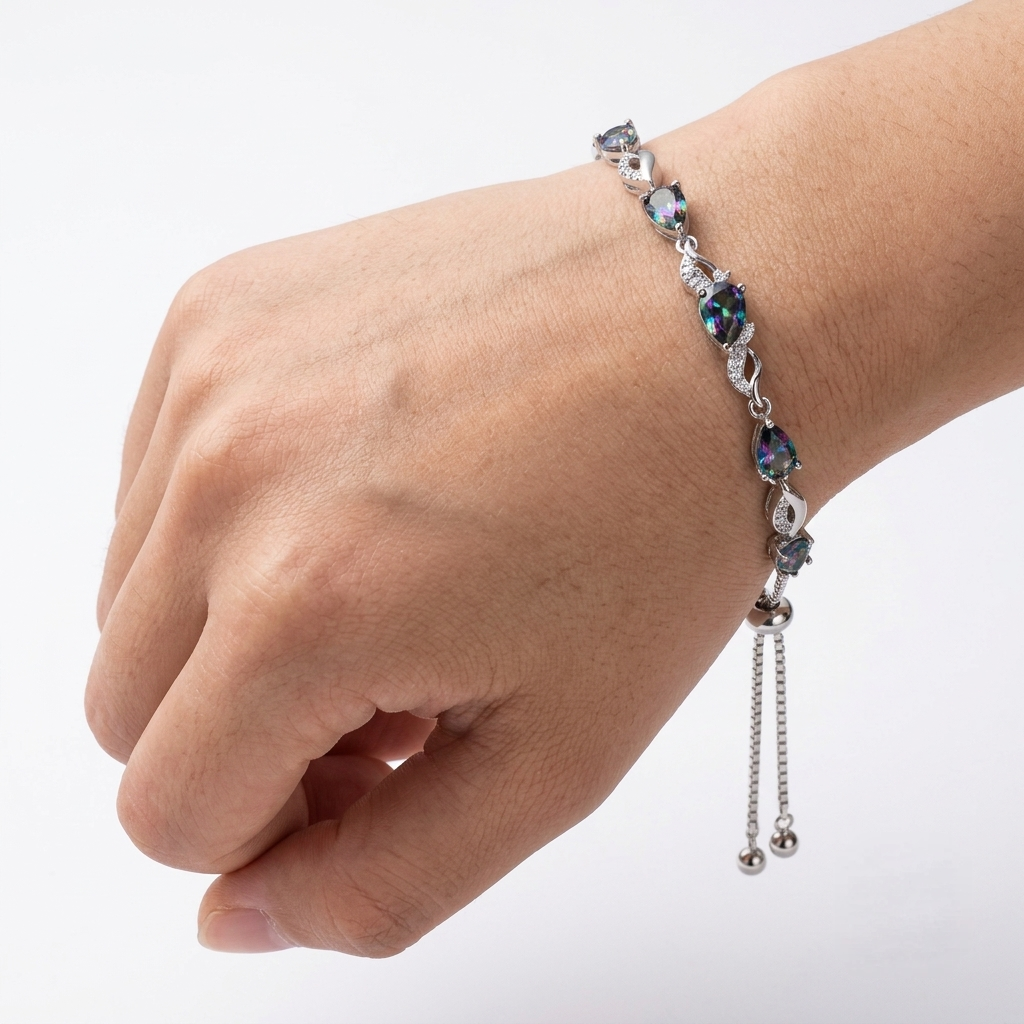 Alexandrite tennis bracelet worn on the wrist, angled styling shot