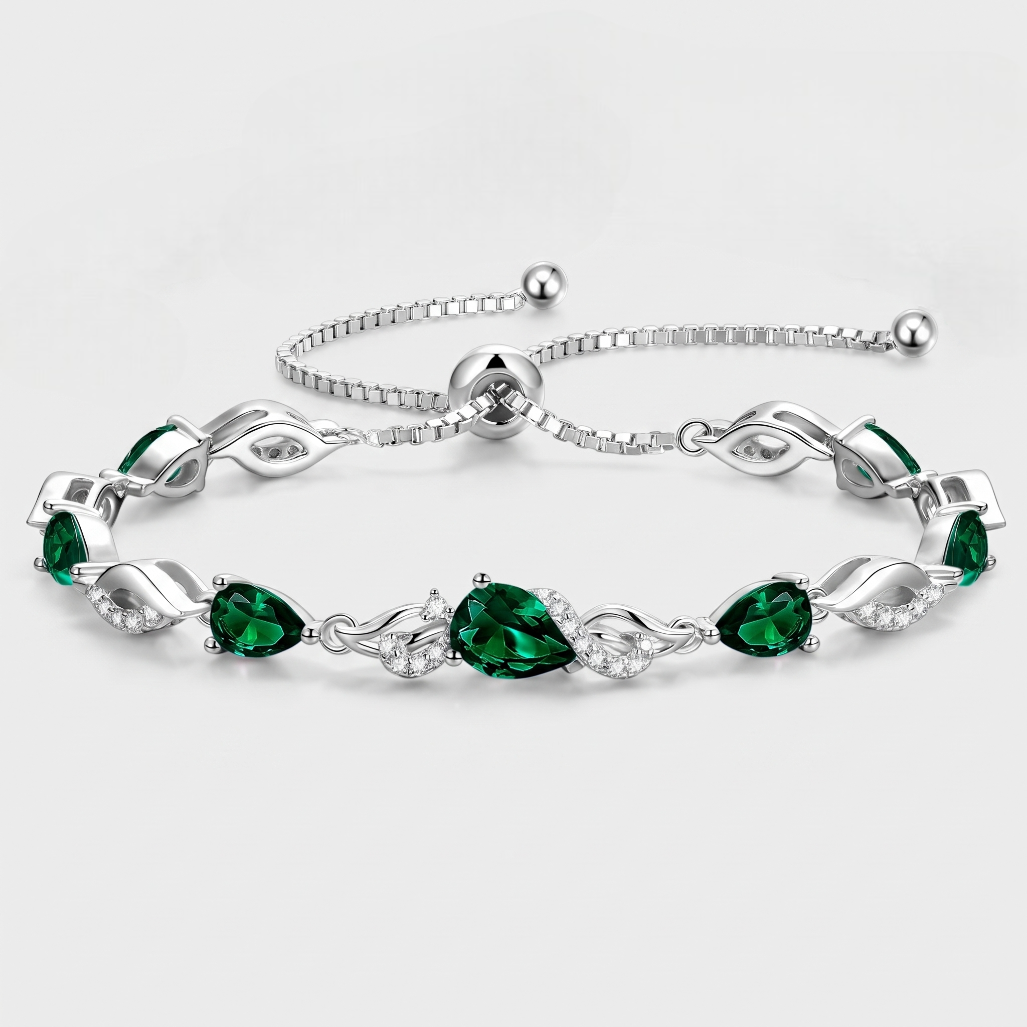 Emerald teardrop tennis bracelet in sterling silver with adjustable bolo clasp