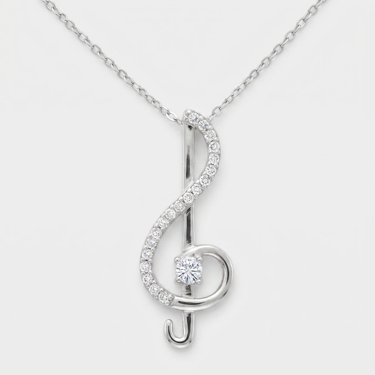 Sterling silver treble clef pendant necklace set with white moissanite stones