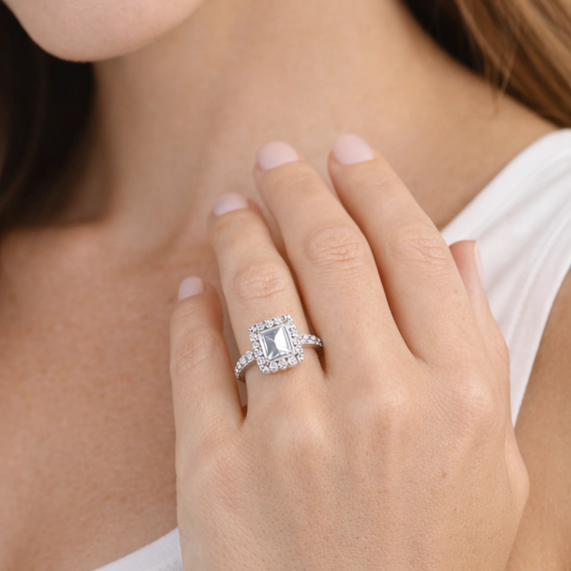 emerald cut moissanite halo engagement ring detail close-up from MH Elegance luxury wedding rings collection