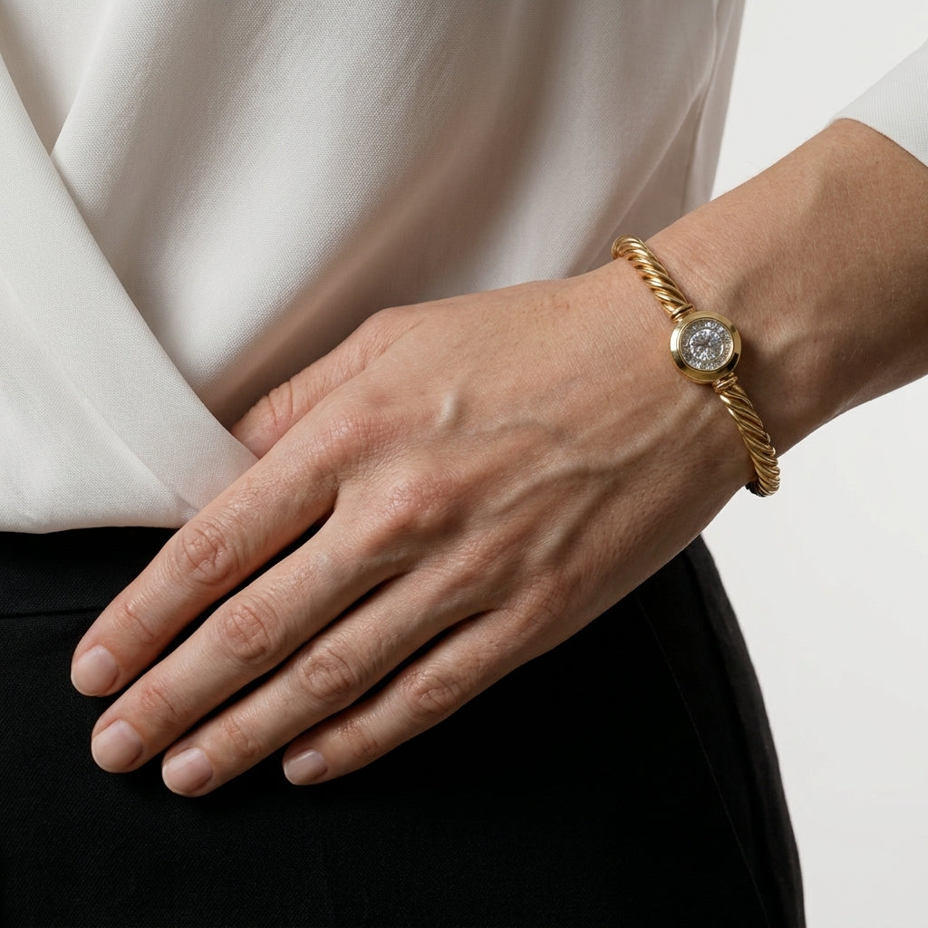 Gold plated rope chain bracelet with cubic zirconia paired with a white top and black skirt