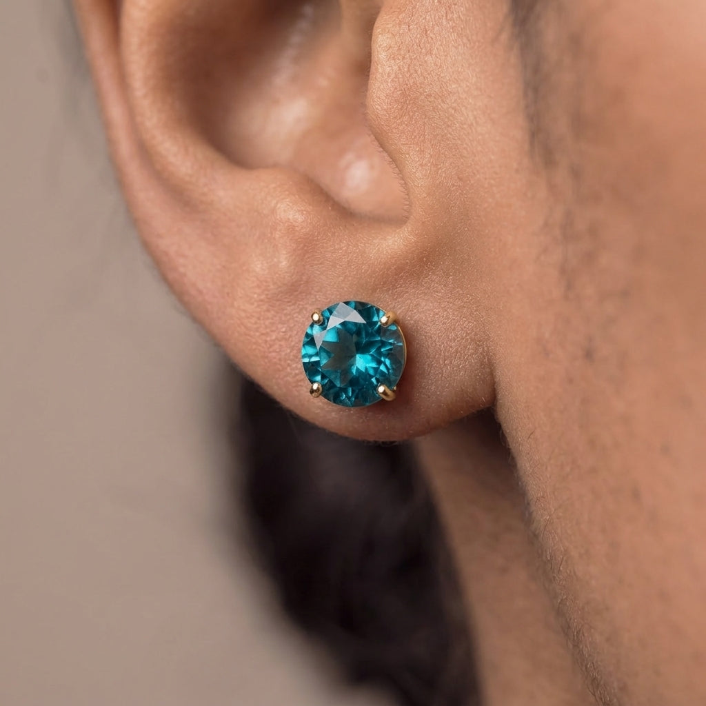 Puces d'oreilles en topaze bleue