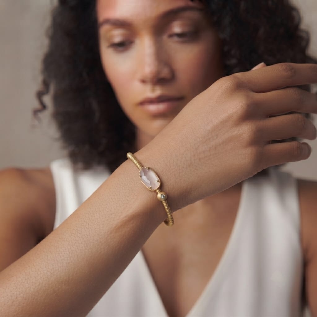 Gold plated beaded bracelet with a blush rose quartz stone and a pave accent bead