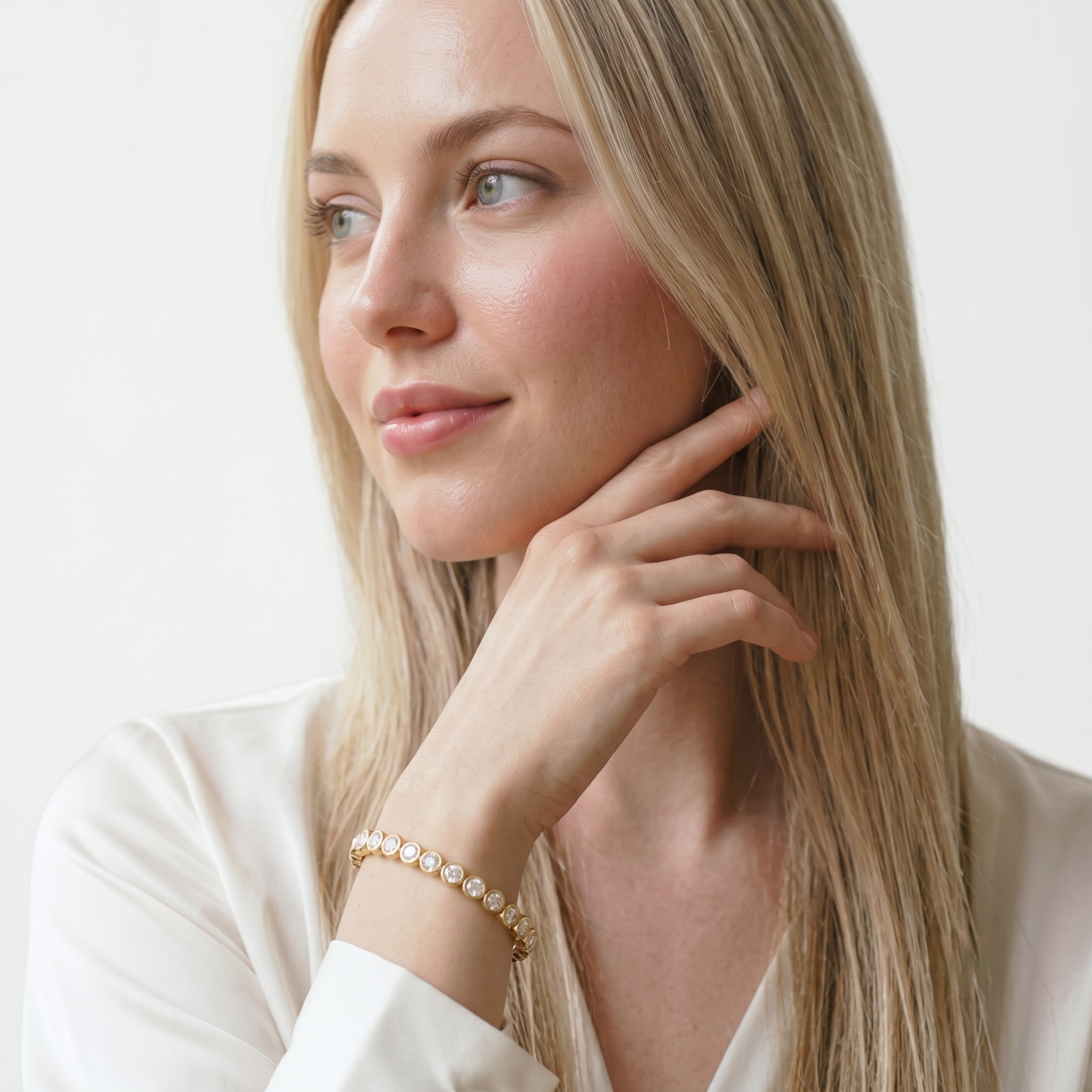 Close-up of the gold filled bangle bracelet with sparkling cubic zirconia stones worn on the wrist