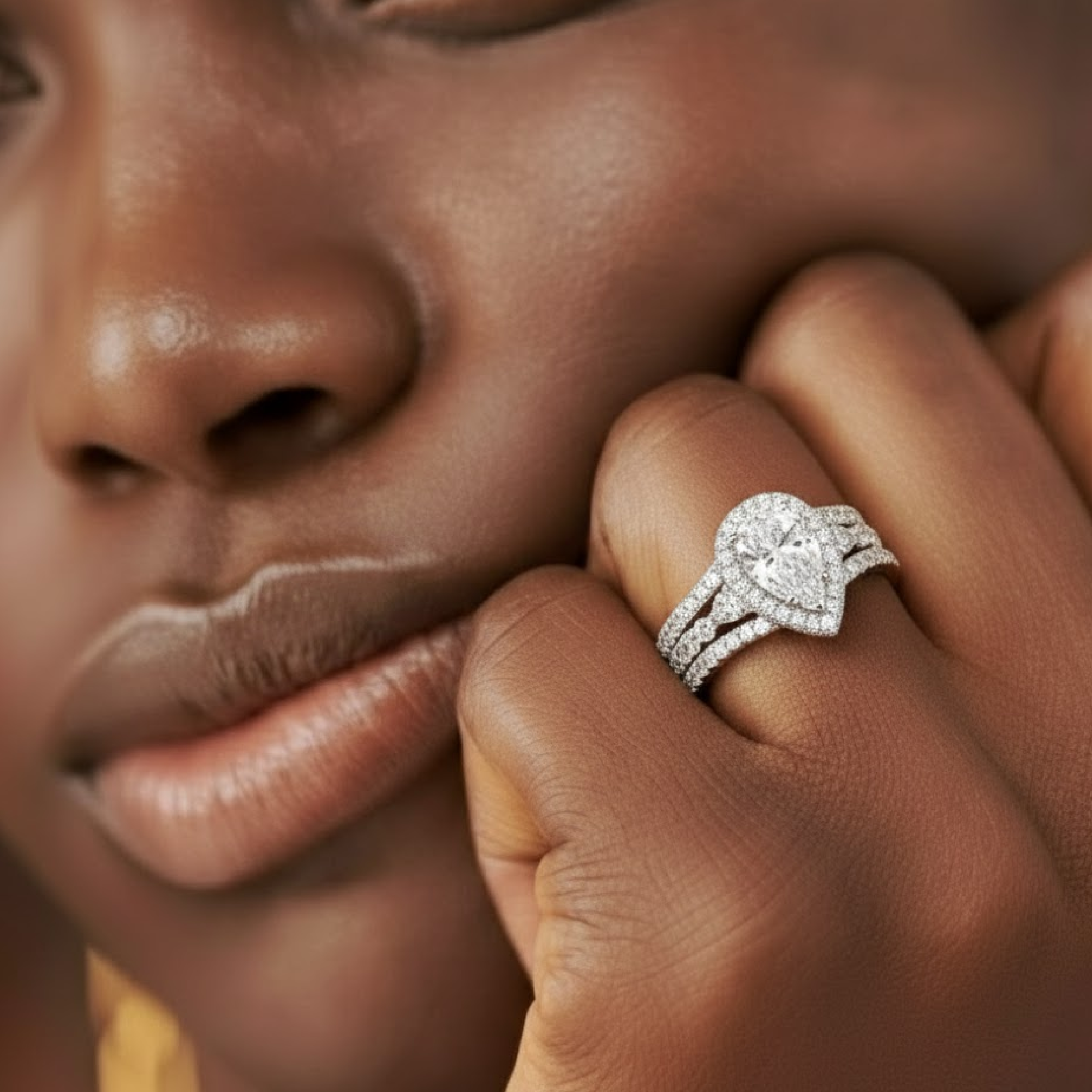 Close-up of pear shaped cubic zirconia her ring in 925 sterling silver wedding ring set.
