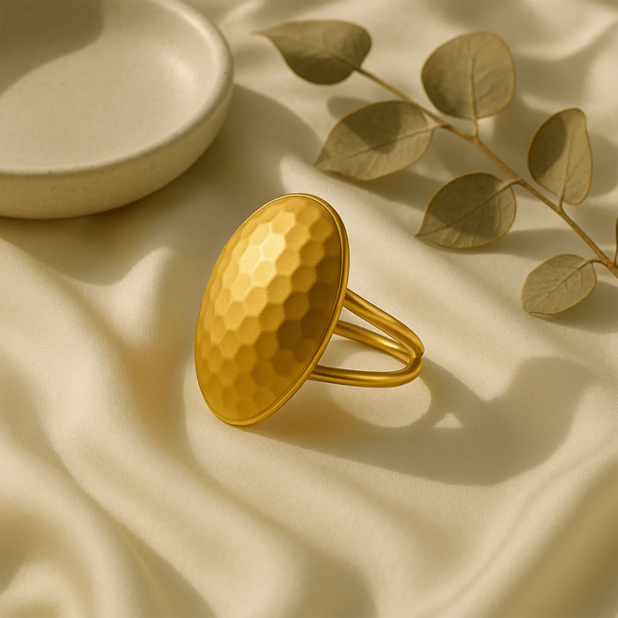 Bold 14K gold textured dome ring worn on a woman's hand showing statement styling and gold presence