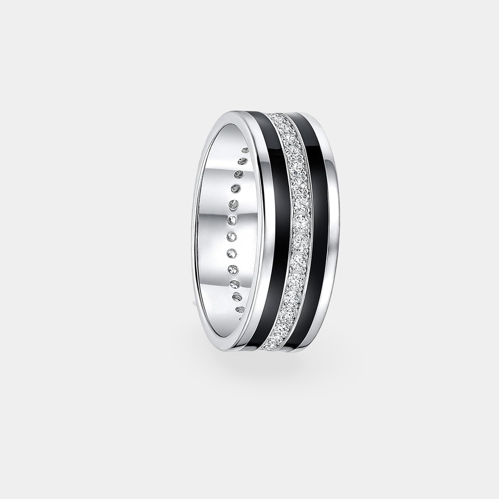 Black men's wedding band with a white moissanite stone on a flat surface
