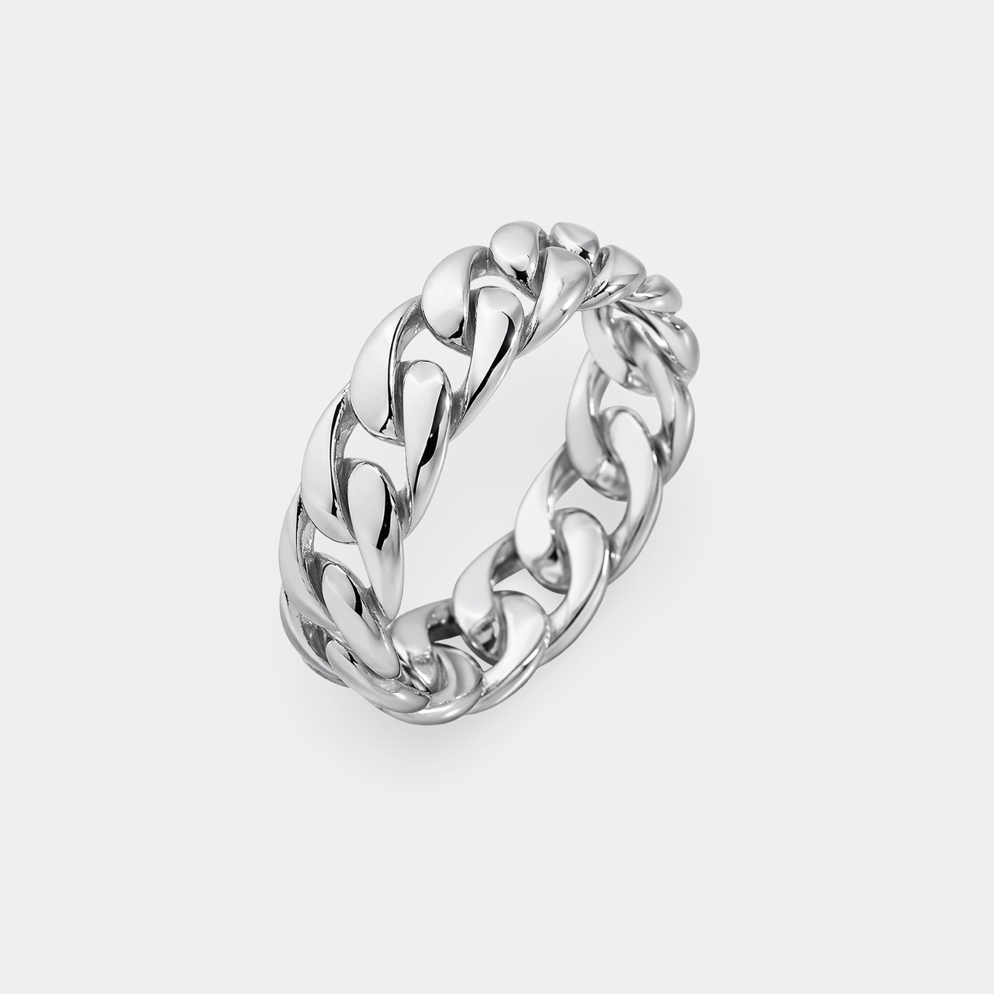 Polished sterling silver Cuban link ring for men on a flat surface