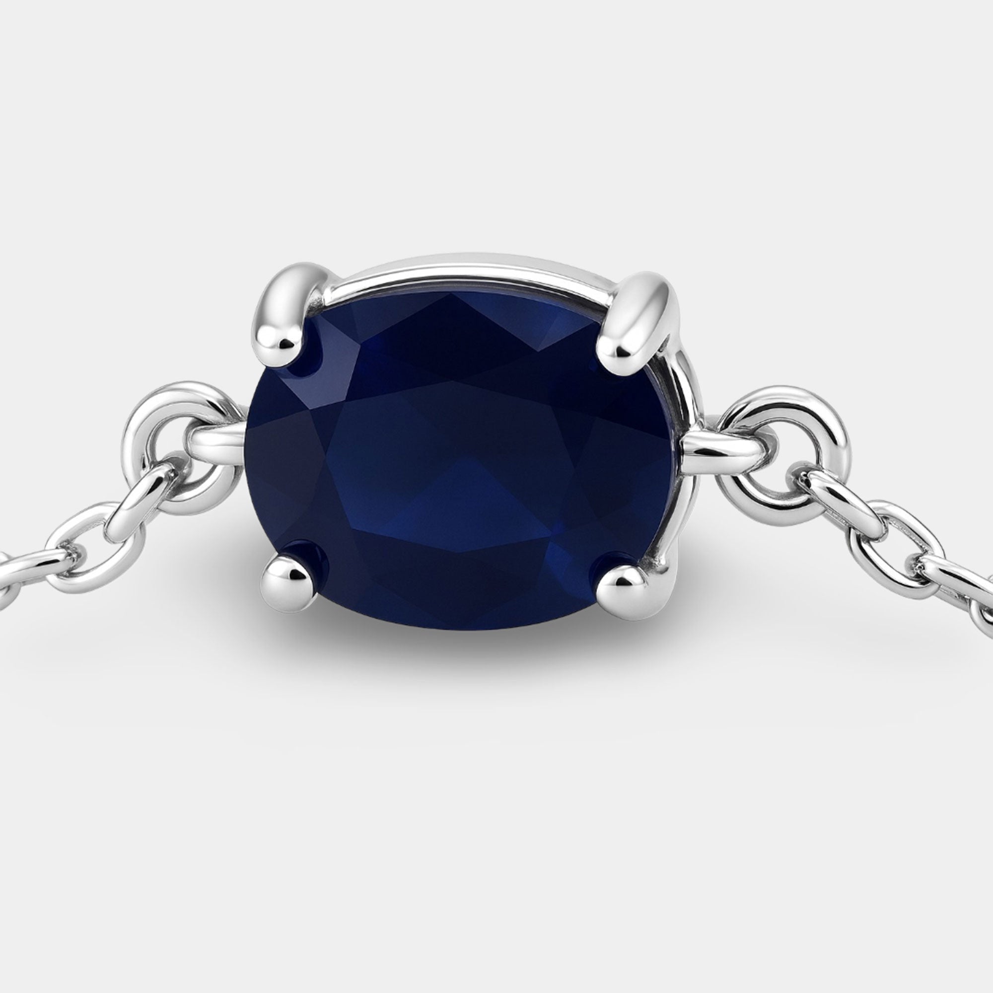 Blue sapphire birthstone bolo bracelet worn on the wrist as a September gift for her
