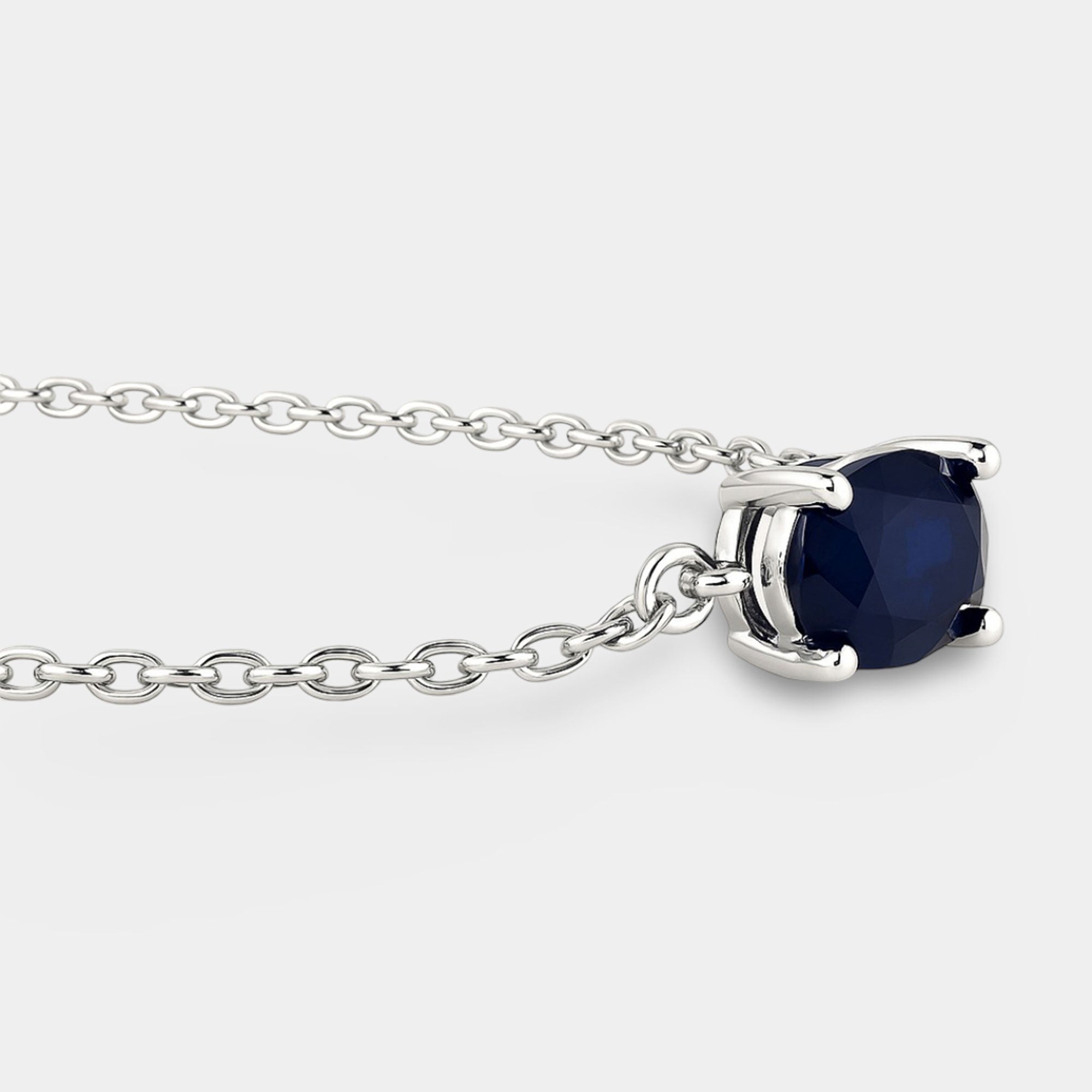 Adjustable sterling silver sapphire bolo bracelet shown with its slide clasp