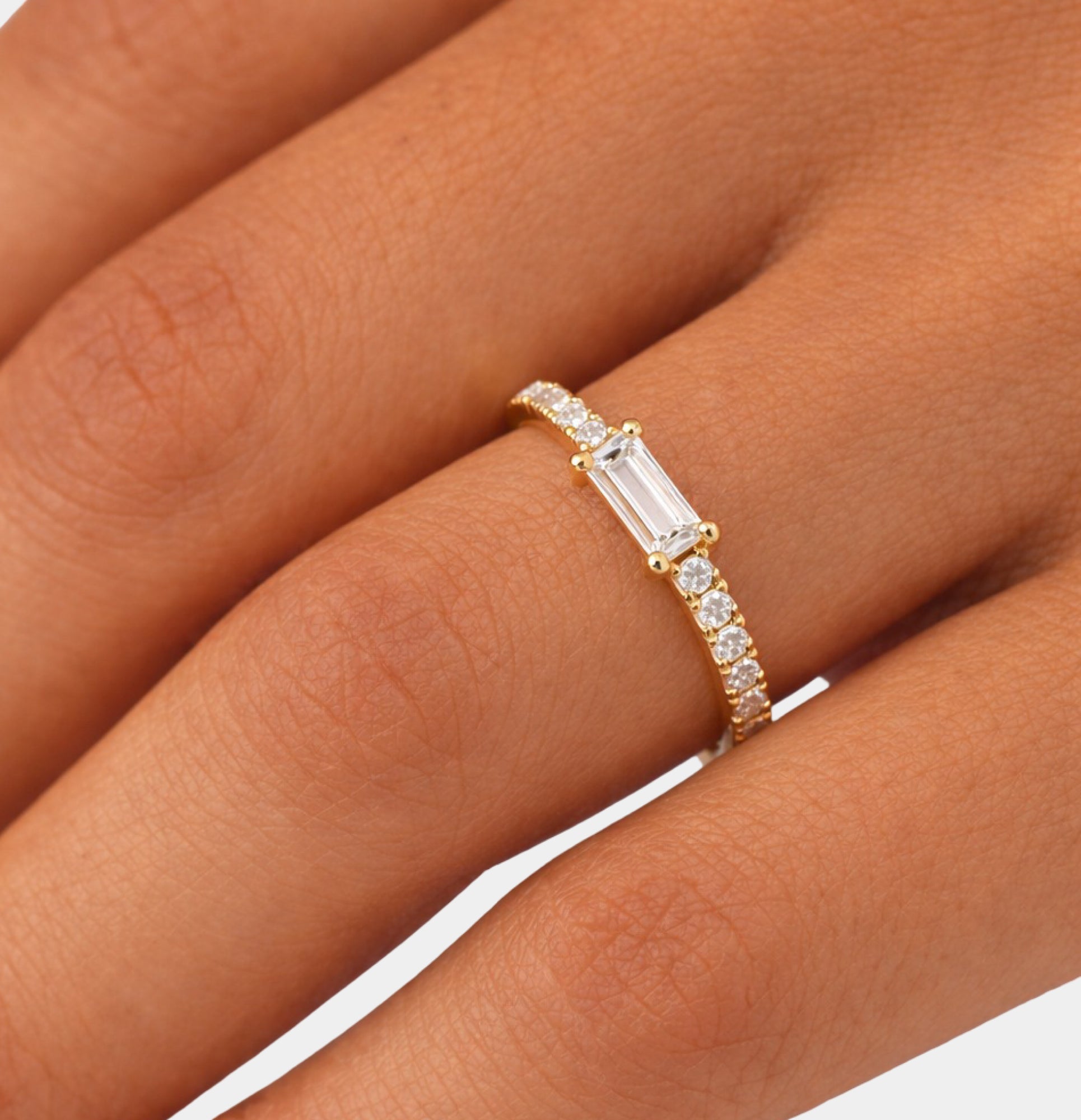 Gold plated sterling silver eternity ring shown at an angle to show the sparkle