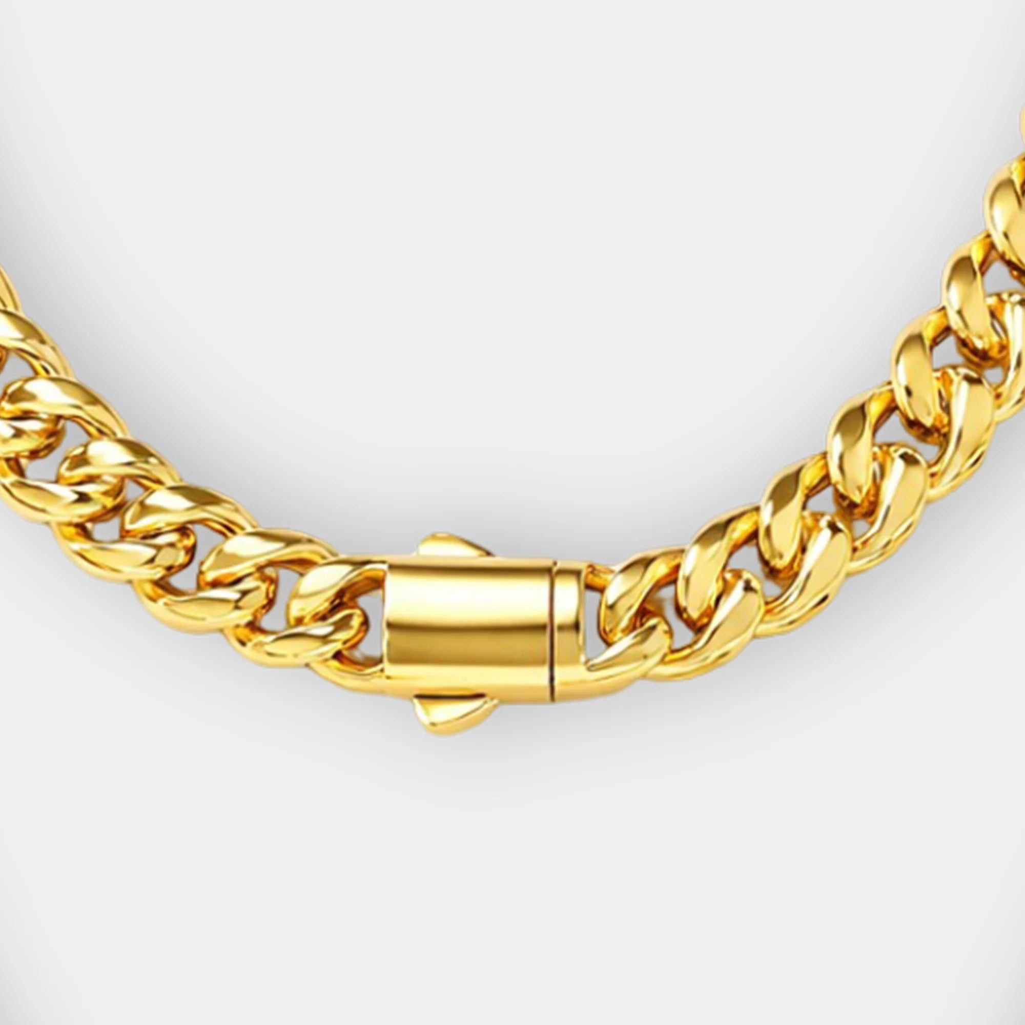 Gold Cuban link chain necklace shown on a man's neck