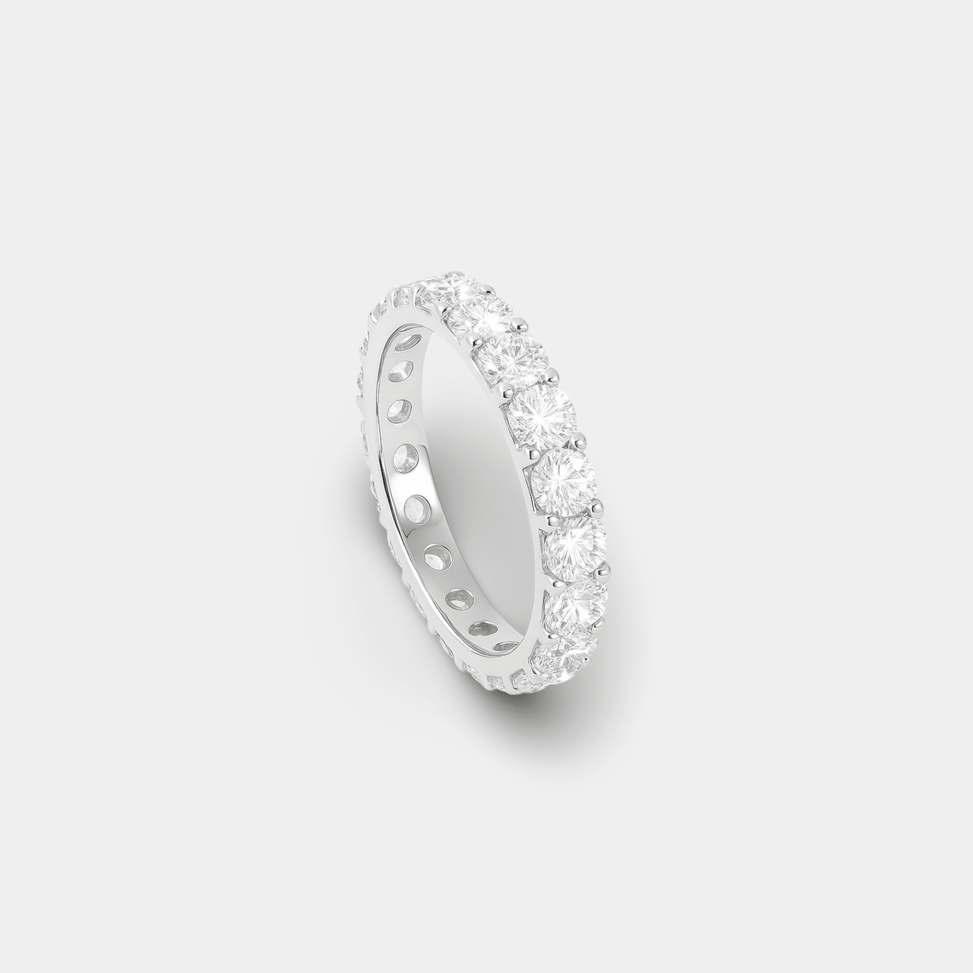 Second angle of the white gold cubic zirconia eternity band highlighting the even row of sparkling square-cut stones
