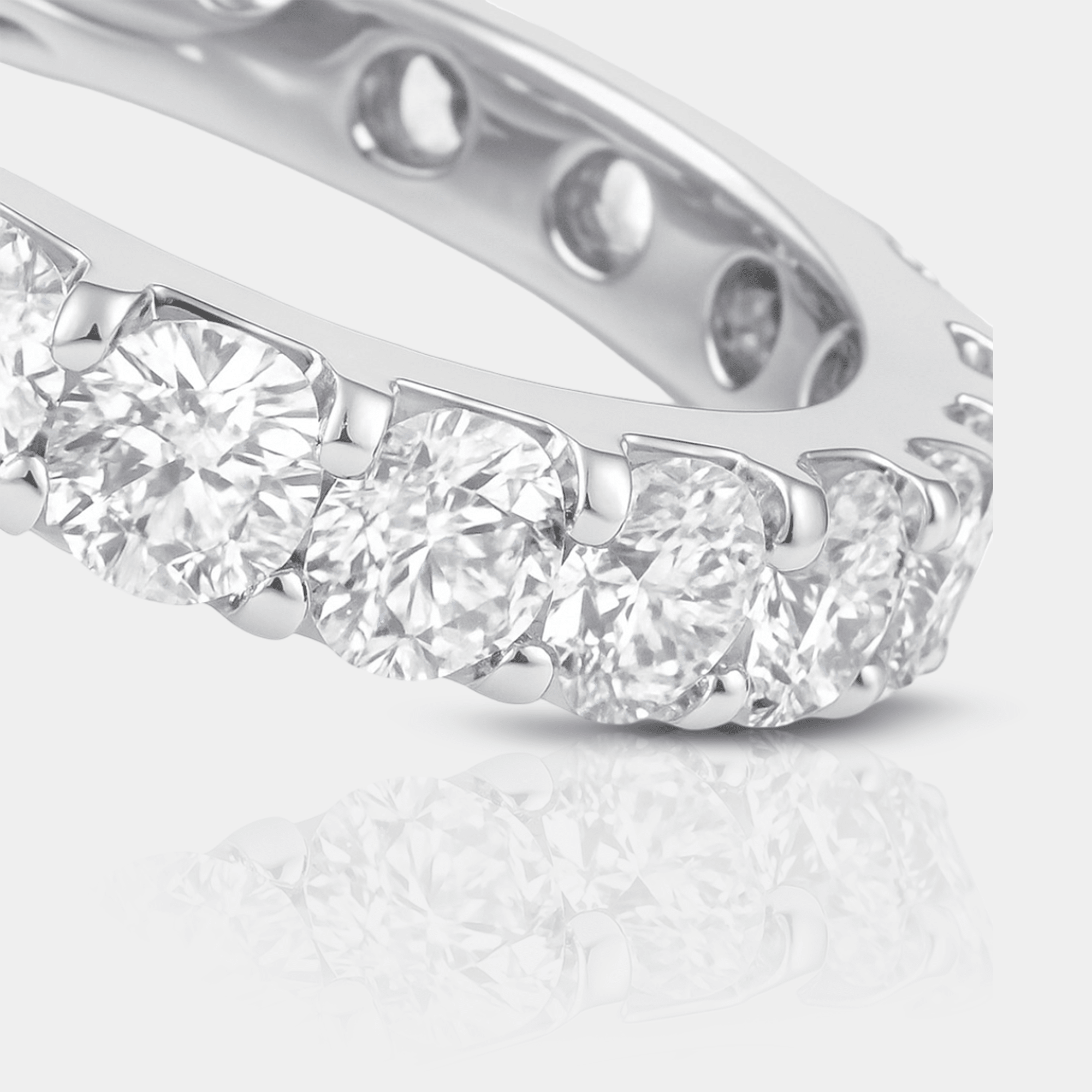Lifestyle photo of the CZ eternity ring stacked with other rings on a woman's hand for an everyday sparkly look