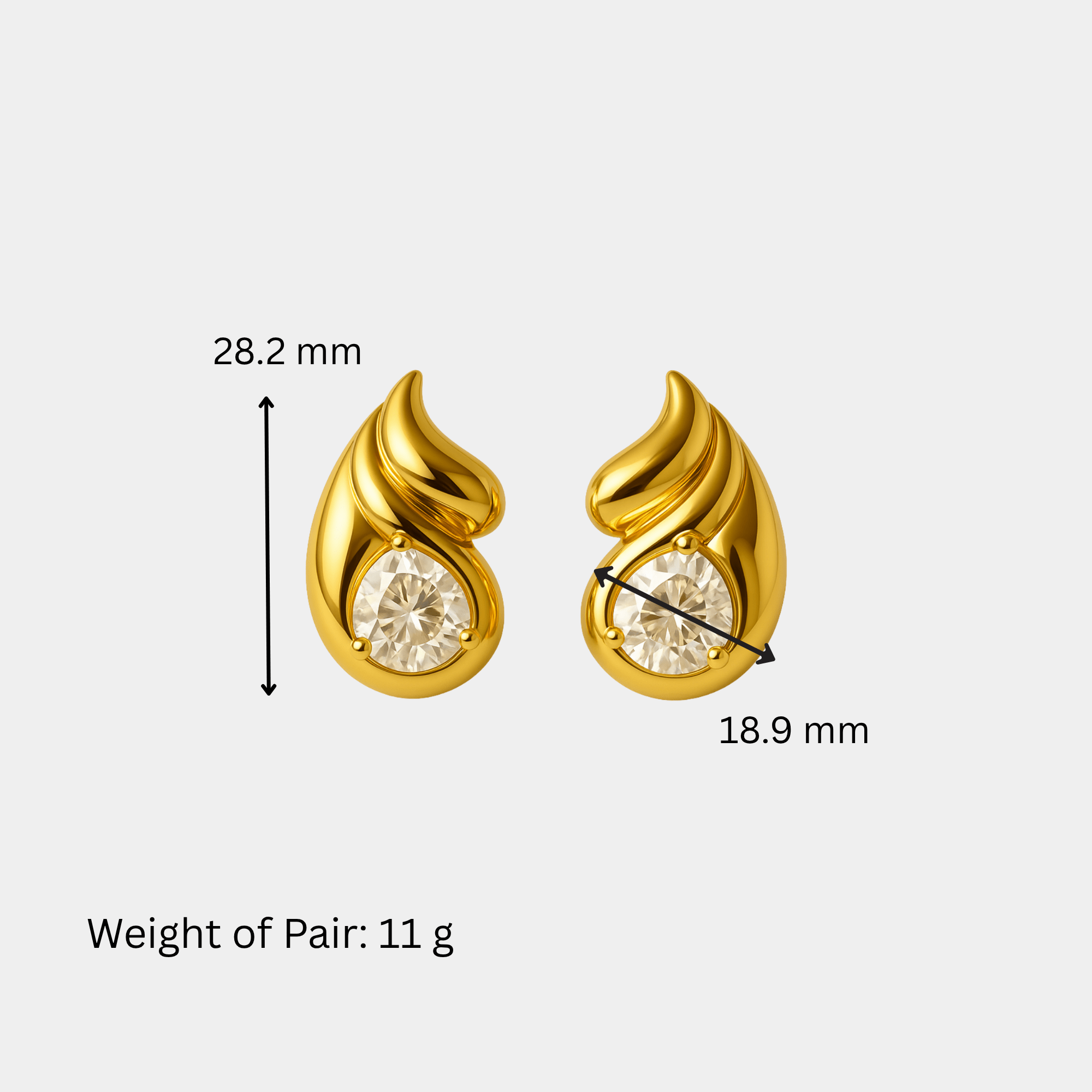 Woman wearing gold double teardrop stud earrings with cubic zirconia.