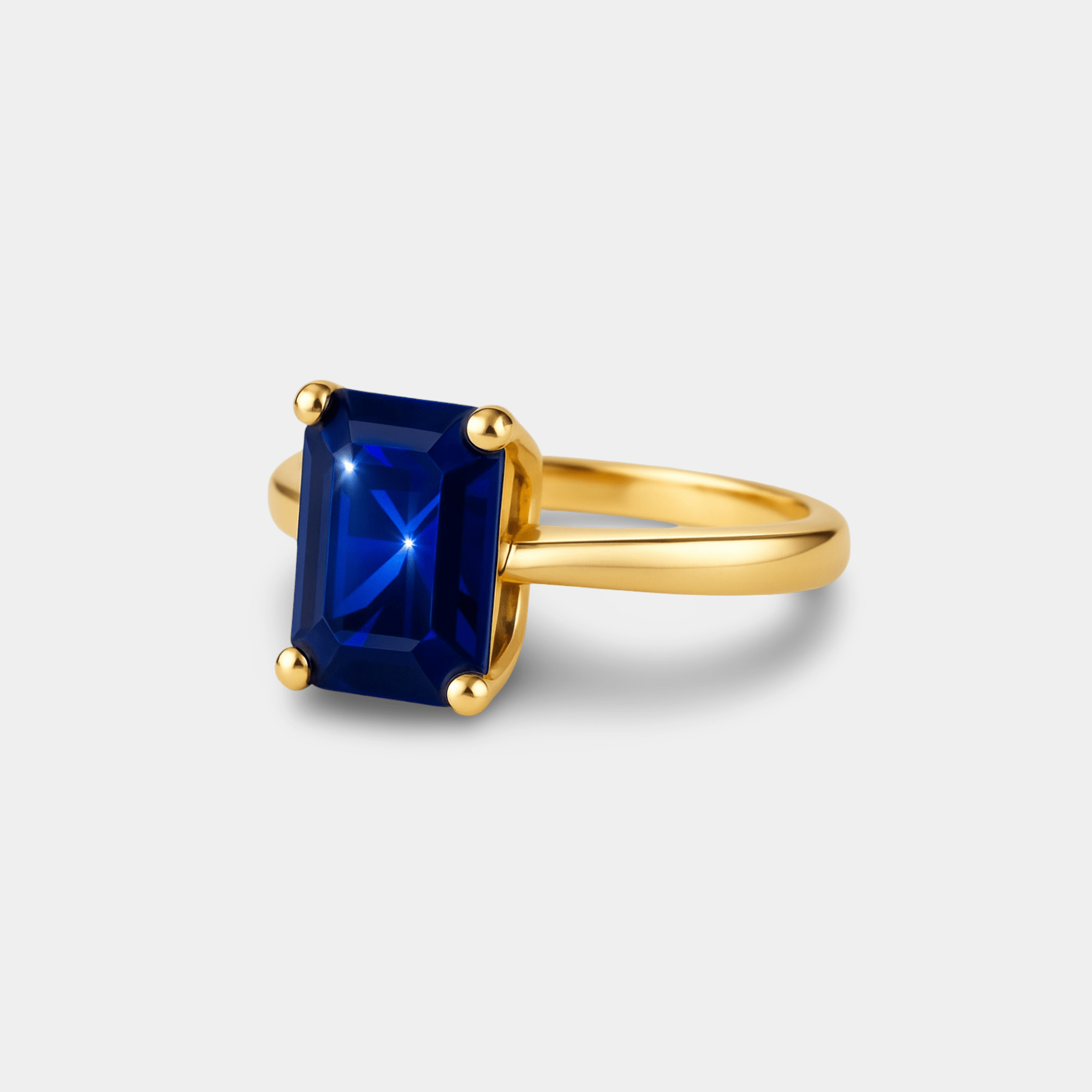 Emerald-Cut Blue Sapphire Solitaire Ring - MH ELEGANCE - Emerald-Cut Blue Sapphire Solitaire Ring - MH ELEGANCE -
