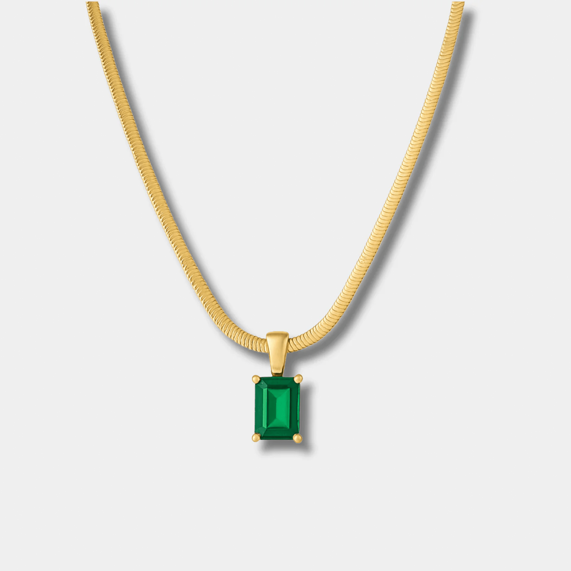 Green zircon geometric pendant shown at an angle.