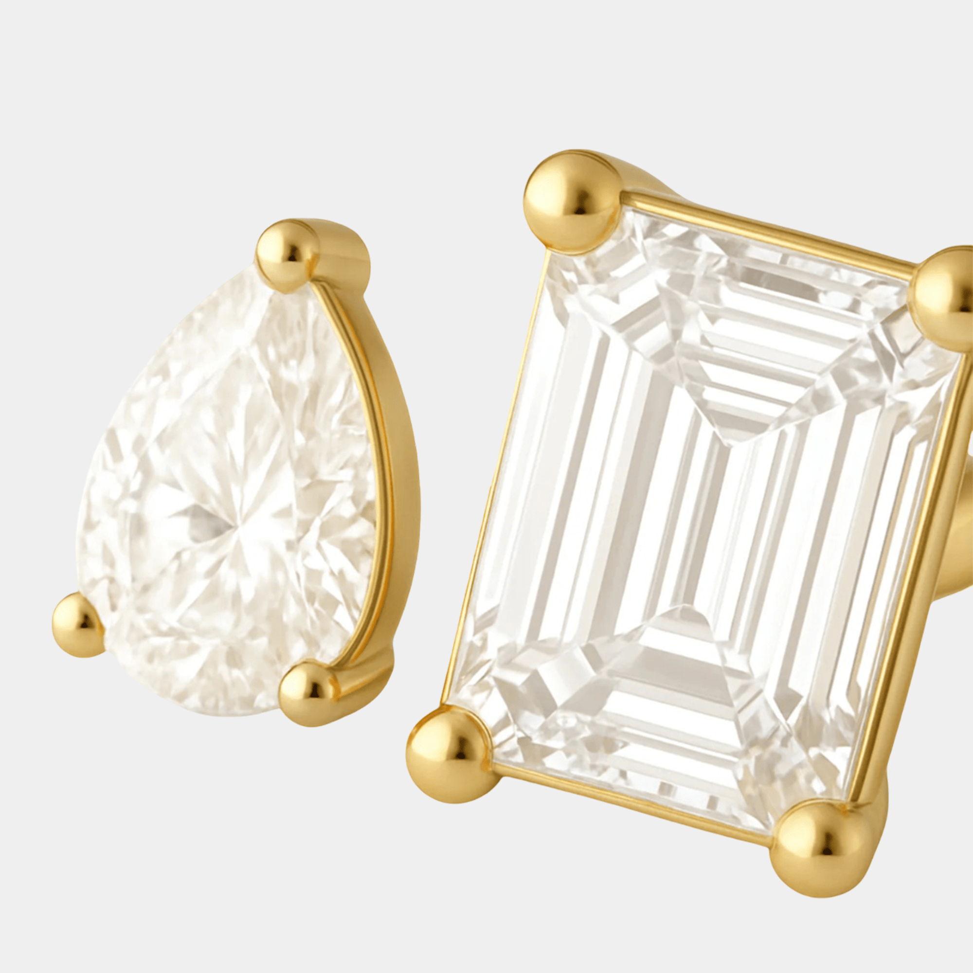Close-up of the two cubic zirconia crystals on the gold dual ring