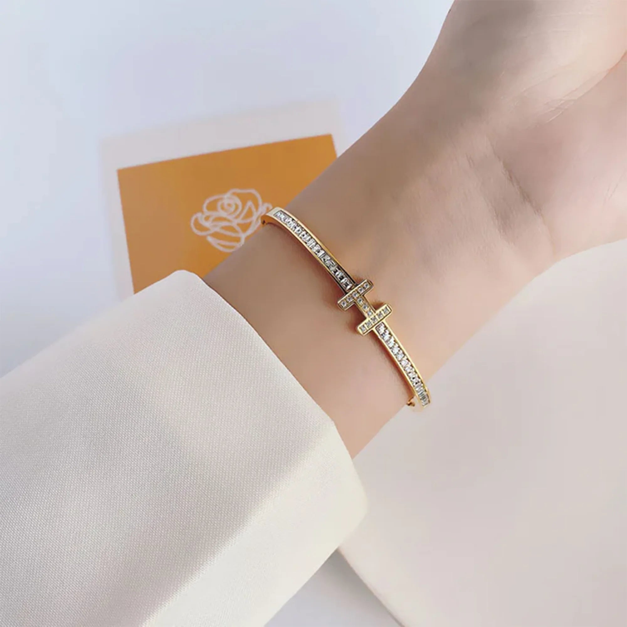 Gold cubic zirconia letter H bracelet, top view of the full bangle