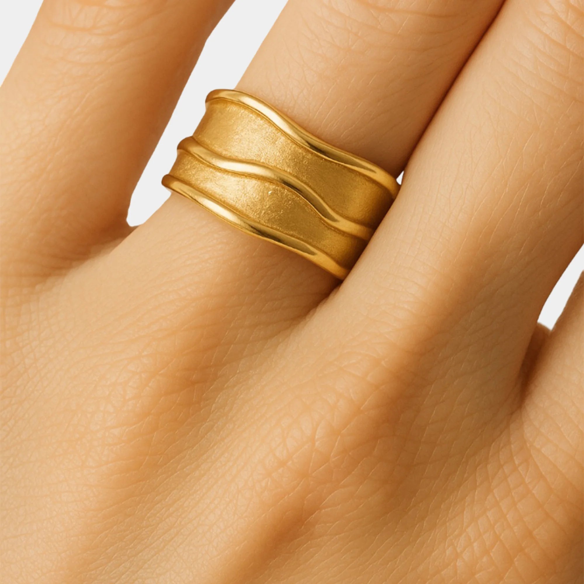Close-up of the hammered ring's textured finish and 18K gold plating