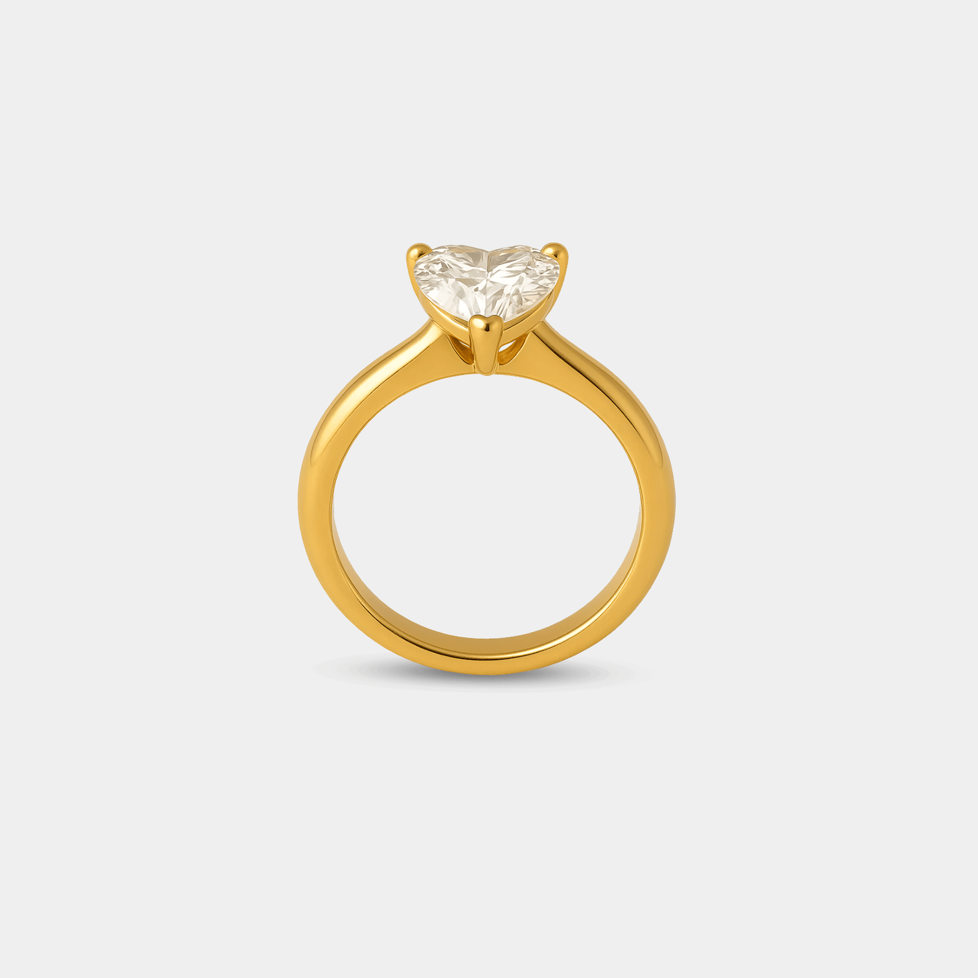 Side profile of the gold heart shaped zircon ring showing the adjustable open band