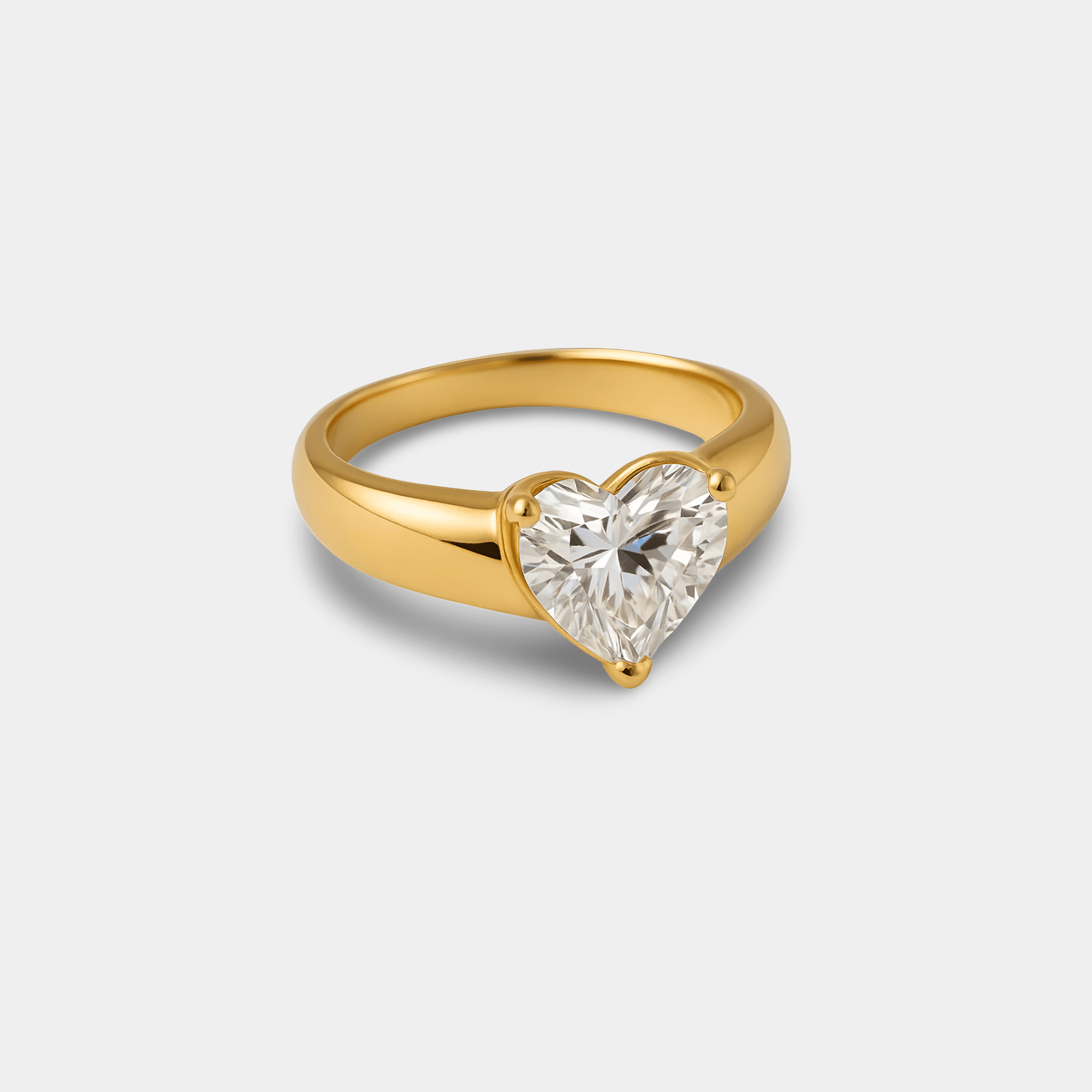Close-up of the prong-set heart-shaped cubic zirconia stone on the gold cocktail ring