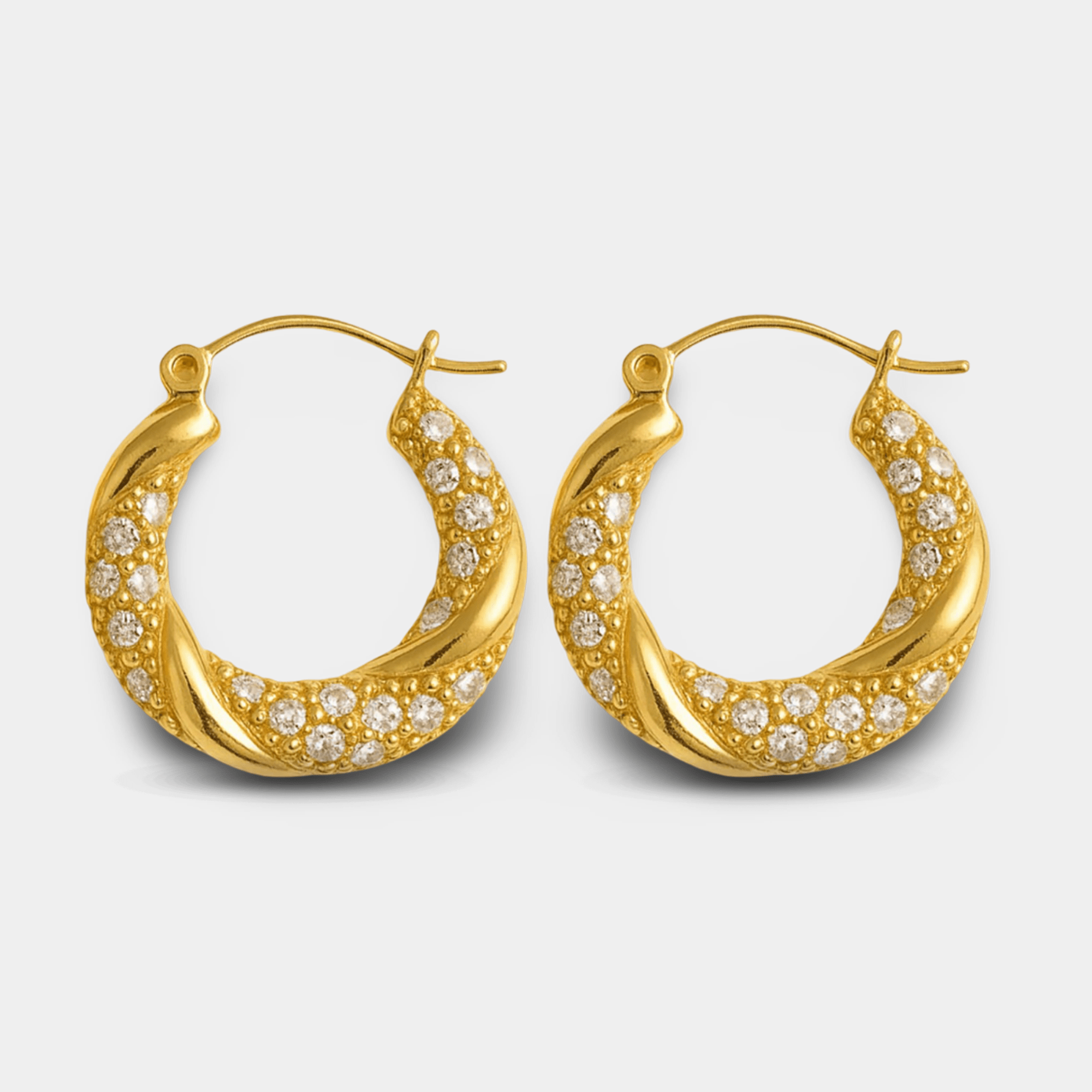 Zoomed view of 18K gold plated twisted rope hoop earrings with cubic zirconia pavé accents, hypoallergenic design