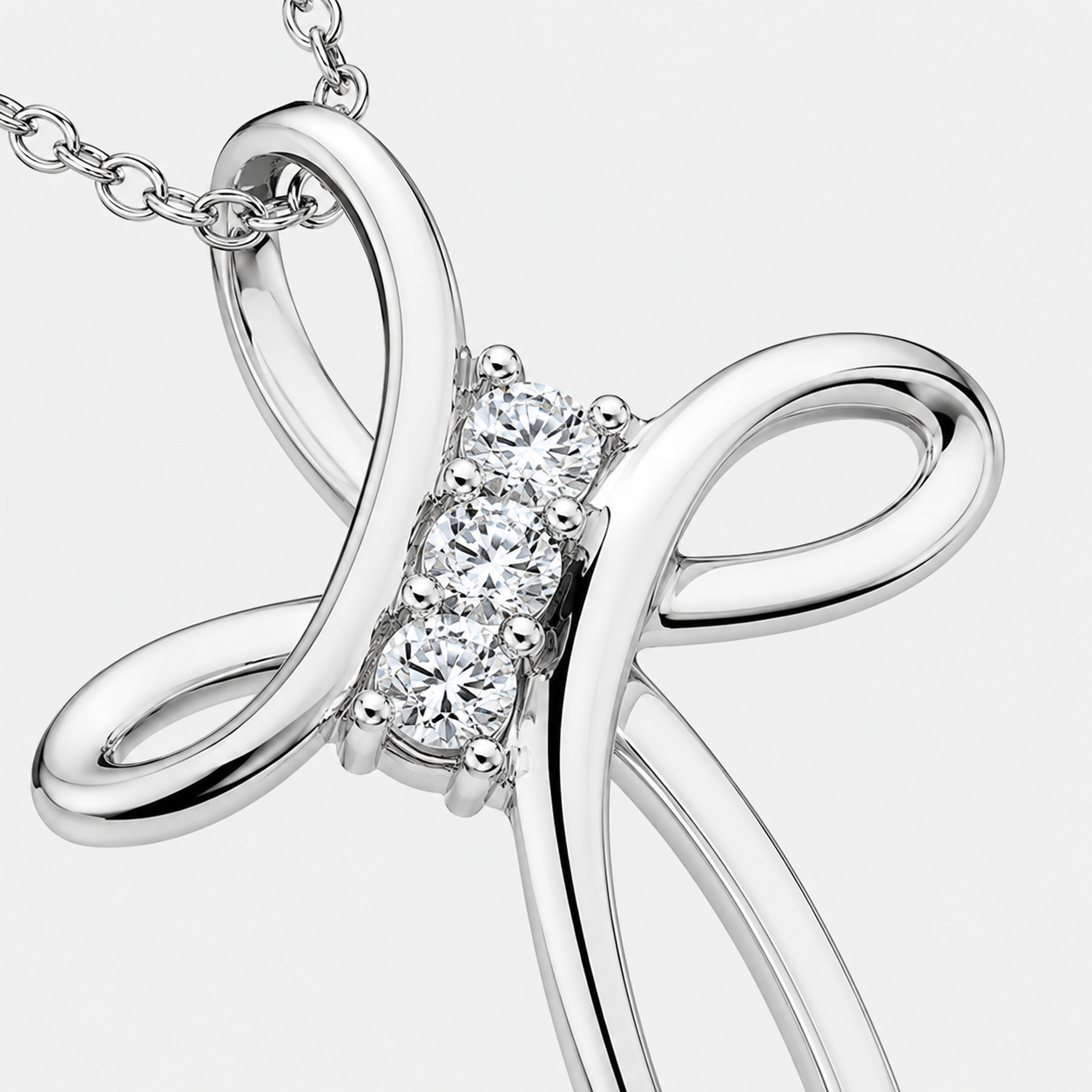 Moissanite infinity cross necklace shown on a cable chain