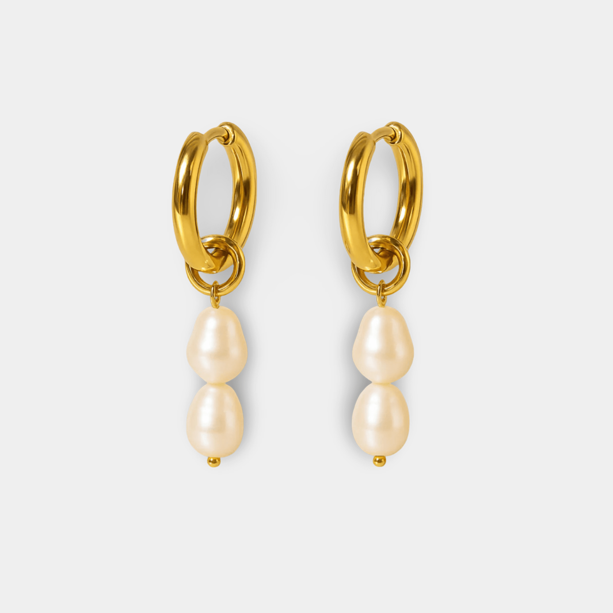 Luminous double pearl drop hoop earrings in 18K gold plating with two freshwater pearls on each hoop, pair on white background
