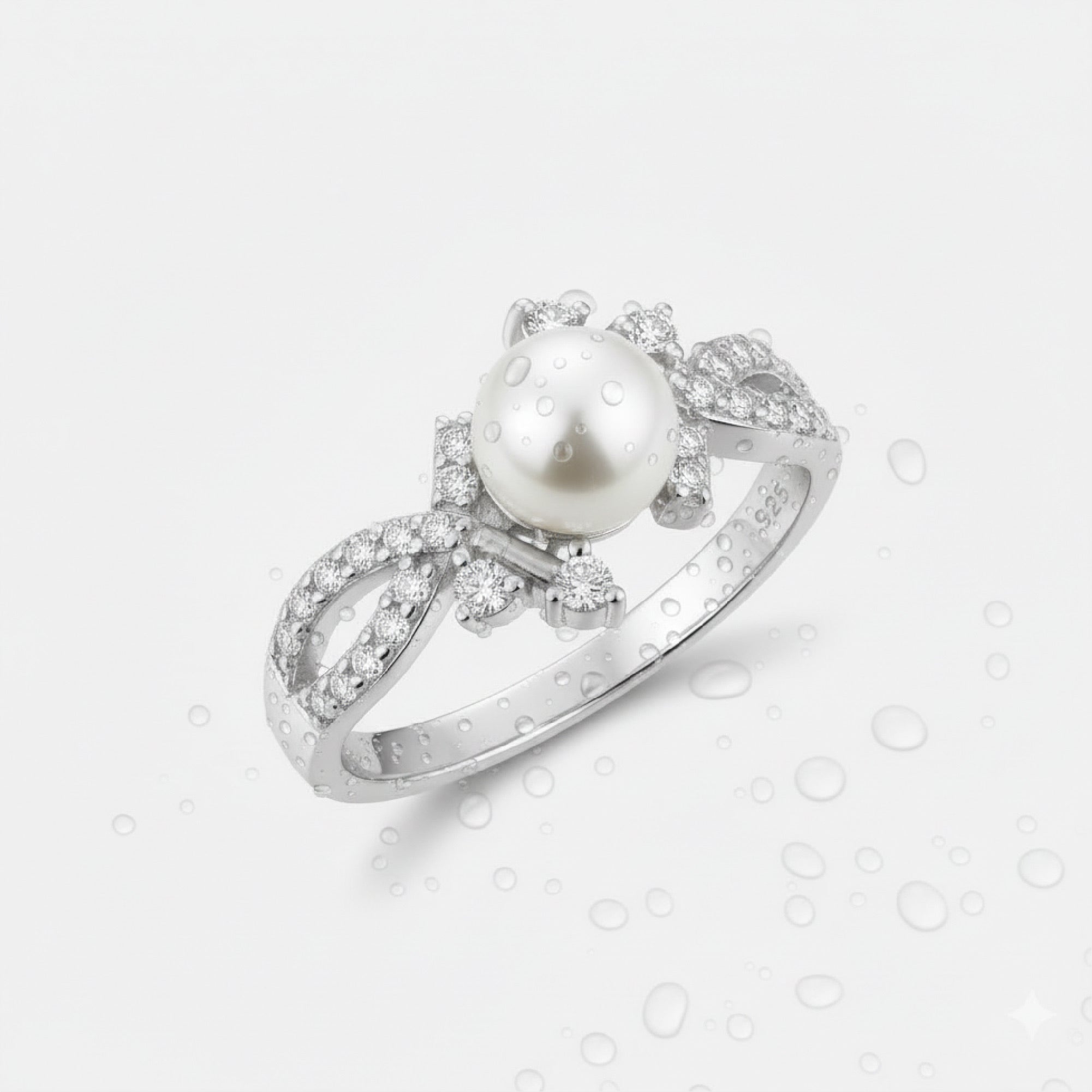 Top-down view of a white freshwater pearl halo ring in rhodium-plated 925 sterling silver, sizes 5 to 10 available