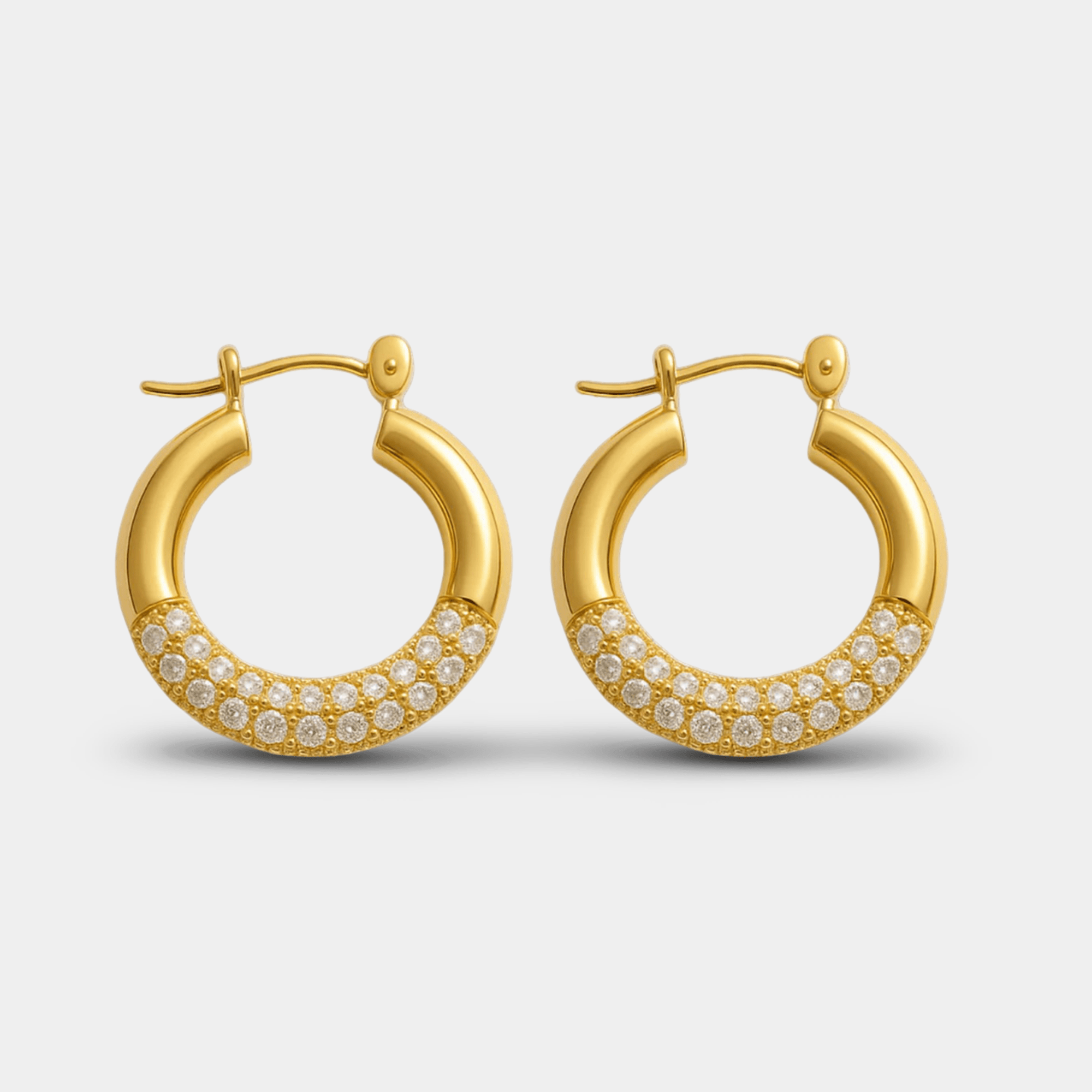 Lustre Luxe gold hoop earrings in titanium steel with hand-set rhinestone pavé, front view on white background