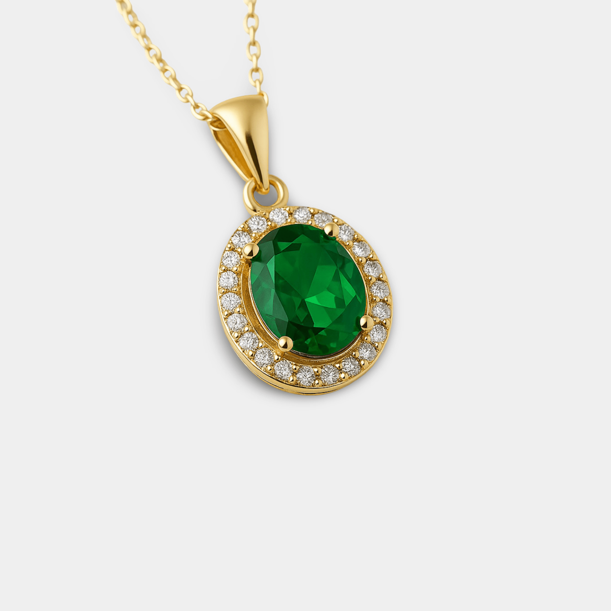 May birthstone emerald halo necklace in gold plated silver, detail view