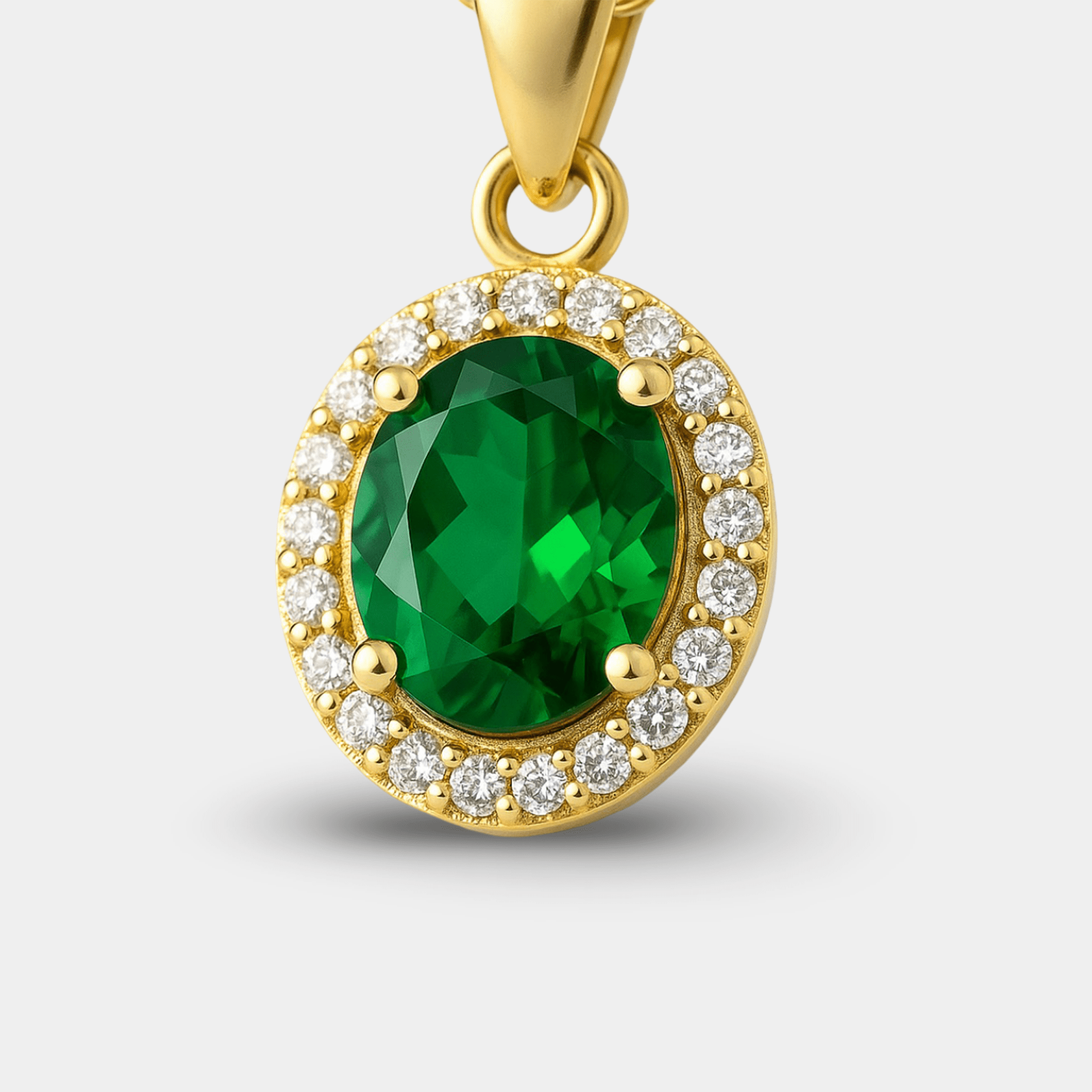 Green emerald halo pendant necklace in gold plated sterling silver, angled view