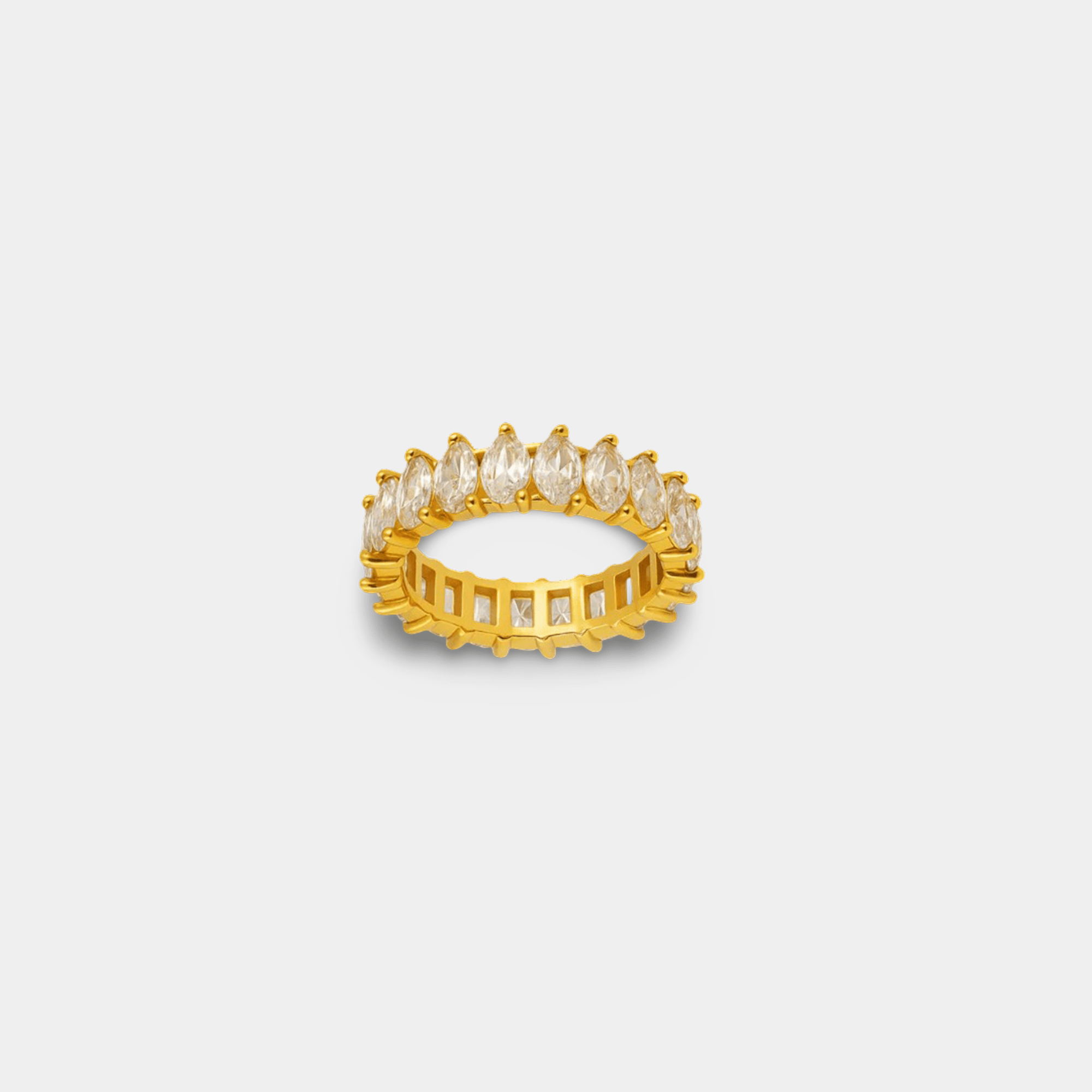 Woman wearing a marquise cut zircon ring showing the finger-elongating stone shape and gold PVD finish